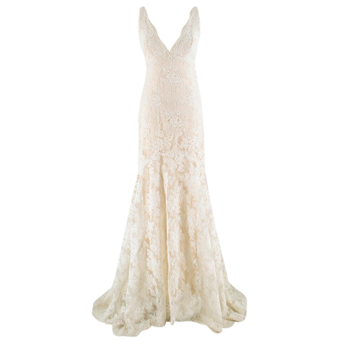 Monique Lhuillier Cream Lace Trumpet Wedding Dress

- Cream lace wedding dress
- Silk lining 
- Hidden zip fastening to the back and hook
- Sleeveless
- V neckline and back 
- Trumpet style 

Please note, these items are pre-owned and may show some