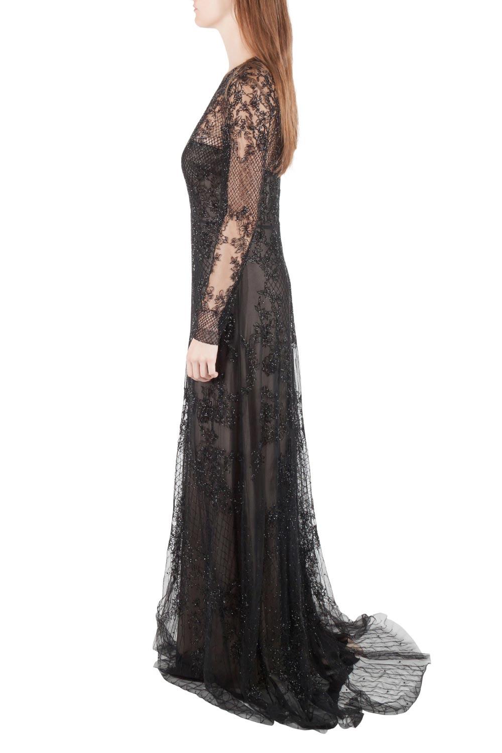 Masterfully constructed in nylon, this gown will make heads turn. This black dress, featuring beautiful embellishments and long sleeve also comes with a zip to create a favorable shape. From Monique Lhuillier, this is a fabulous creation.

Includes: