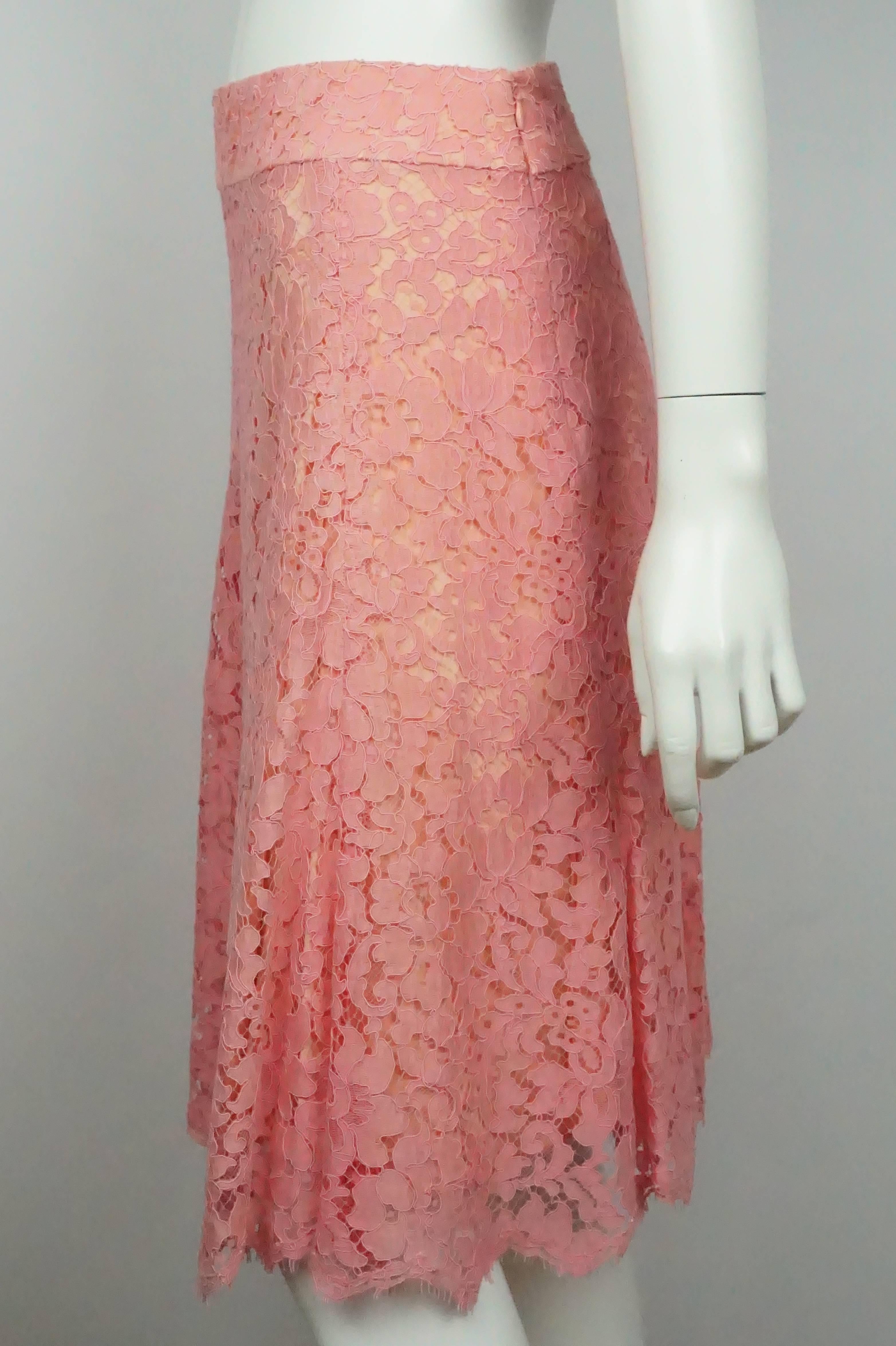 Monique Lhuillier Pink Coral Lace Skirt - 6  This gorgeous lace skirt is in excellent condition. This flare skirt is fitted on top and opens up at the bottom. The skirt is lined in silk and the outside is covered in lace. There is a back zipper with
