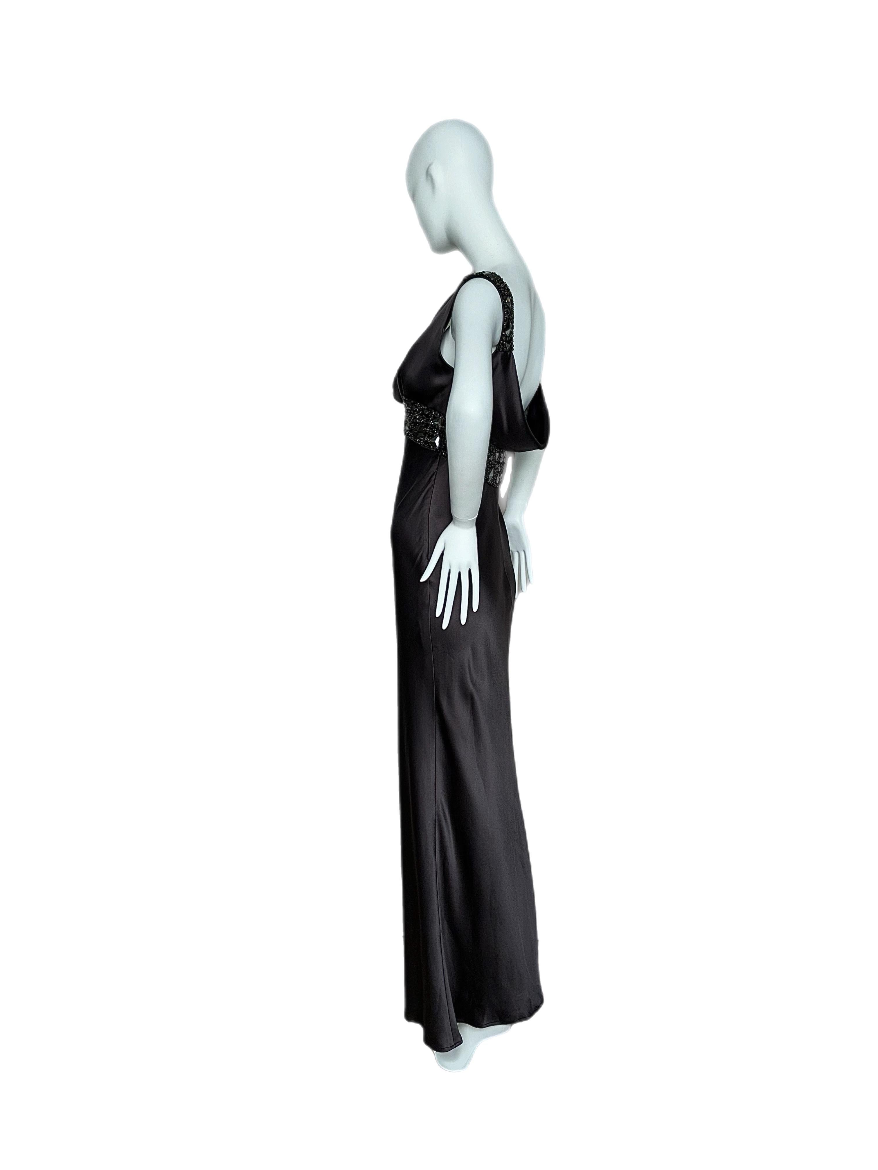 Monique Lhuillier
100% silk
USA size 6
Excellent Condition, minor feeling of wear

Crafted from the softest silk, this Monique Lhuillier evening gown features a cowl neck front, as well as a deeper cowl back. This gown definitely falls into the