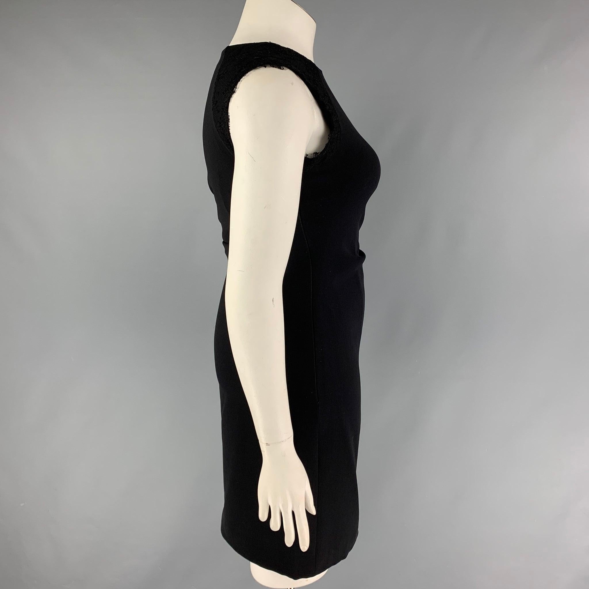 MONIQUE LHUILLIER dress comes in a black viscose / polyester with a silk lining featuring silk lace details, shift style, sleeveless, and a side zip up closure,
Very Good
Pre-Owned Condition. 

Marked:   10 

Measurements: 
 
Shoulder: 14 inches 