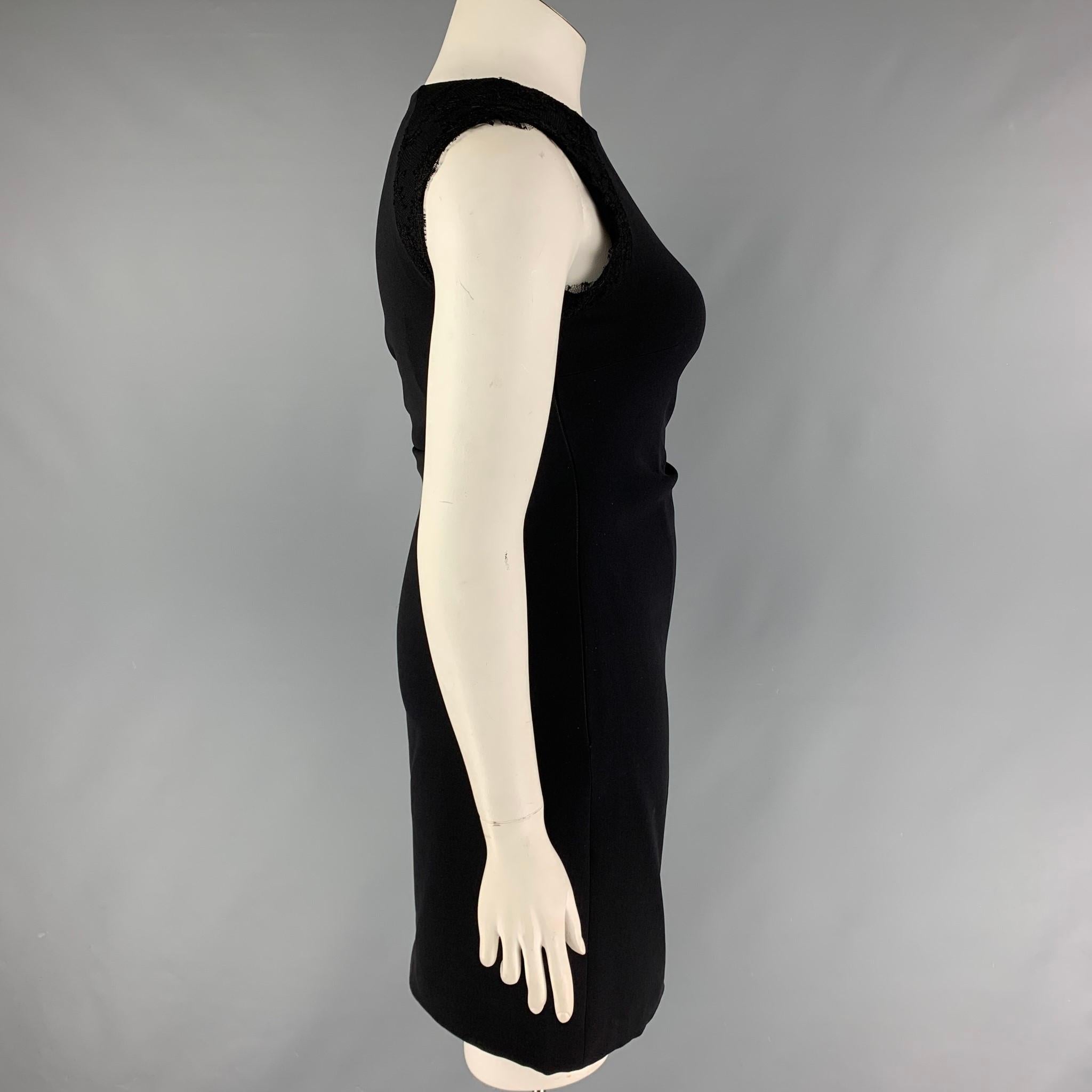 MONIQUE LHUILLIER dress comes in a black viscose / polyester with a silk lining featuring silk lace details, shift style, sleeveless, and a side zip up closure, 

Very Good Pre-Owned Condition.
Marked: 10

Measurements:

Shoulder: 14 in.
Bust: 34