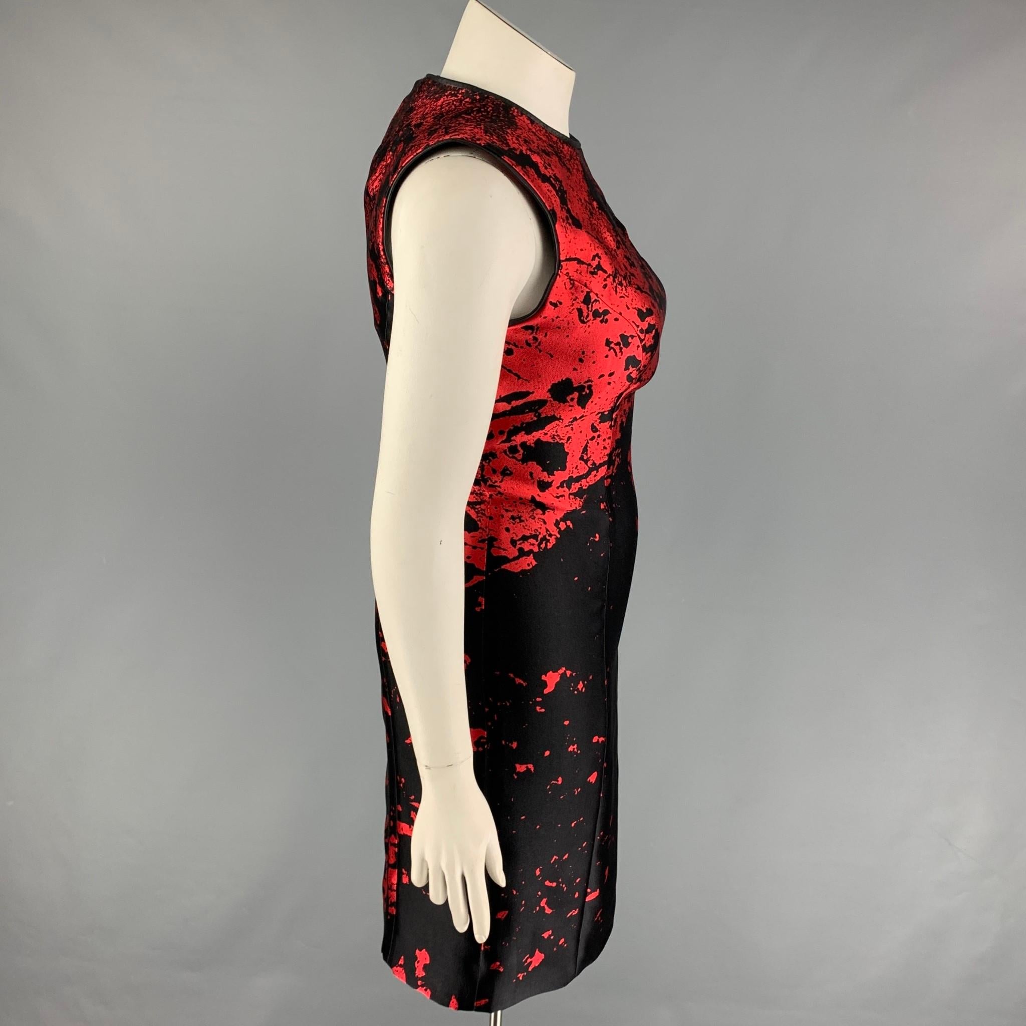 MONIQUE LHUILLIER dress comes in a black & red abstract print wool / lycra featuring a sheath style, leather trim, sleeveless, and a back zip up closure. Made in USA. 

New With Tags. 
Marked: 10
Original Retail Price:
