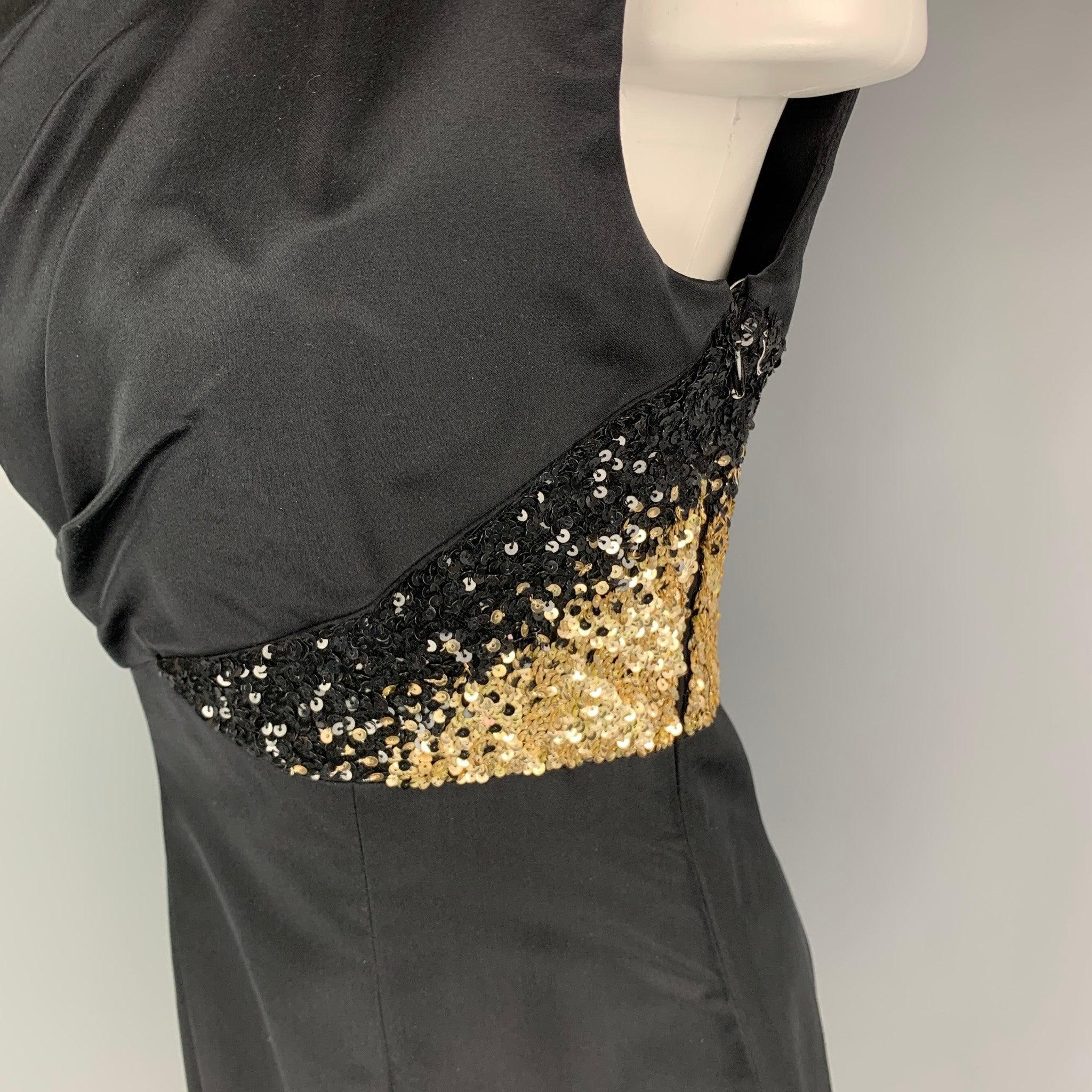 MONIQUE LHUILLIER dress comes in a black rayon featuring a ruched bodice, gold sequined trim, padded shoulders, and a side zipper closure. Made in USA.
Very Good
Pre-Owned Condition. 

Marked:   4 

Measurements: 
 
Shoulder: 18 inches Bust: 34