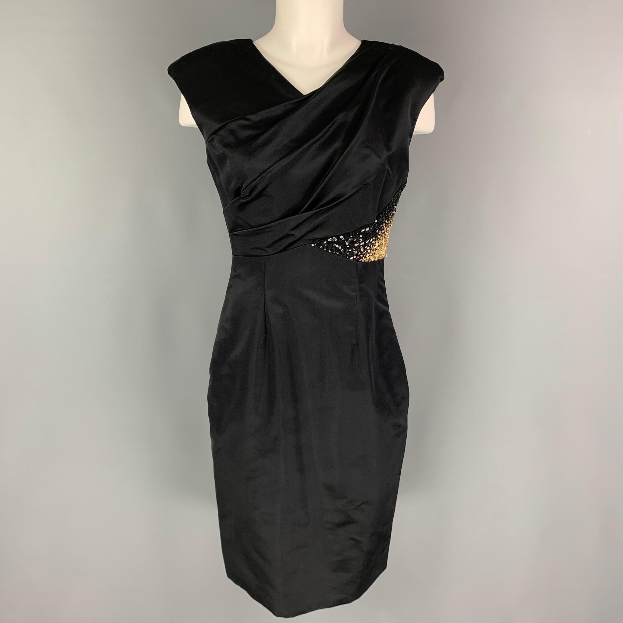 MONIQUE LHUILLIER dress comes in a black rayon featuring a ruched bodice, gold sequined trim, padded shoulders, and a side zipper closure. Made in USA. 

Very Good Pre-Owned Condition.
Marked: 4

Measurements:

Shoulder: 18 in.
Bust: 34 in.
Waist: