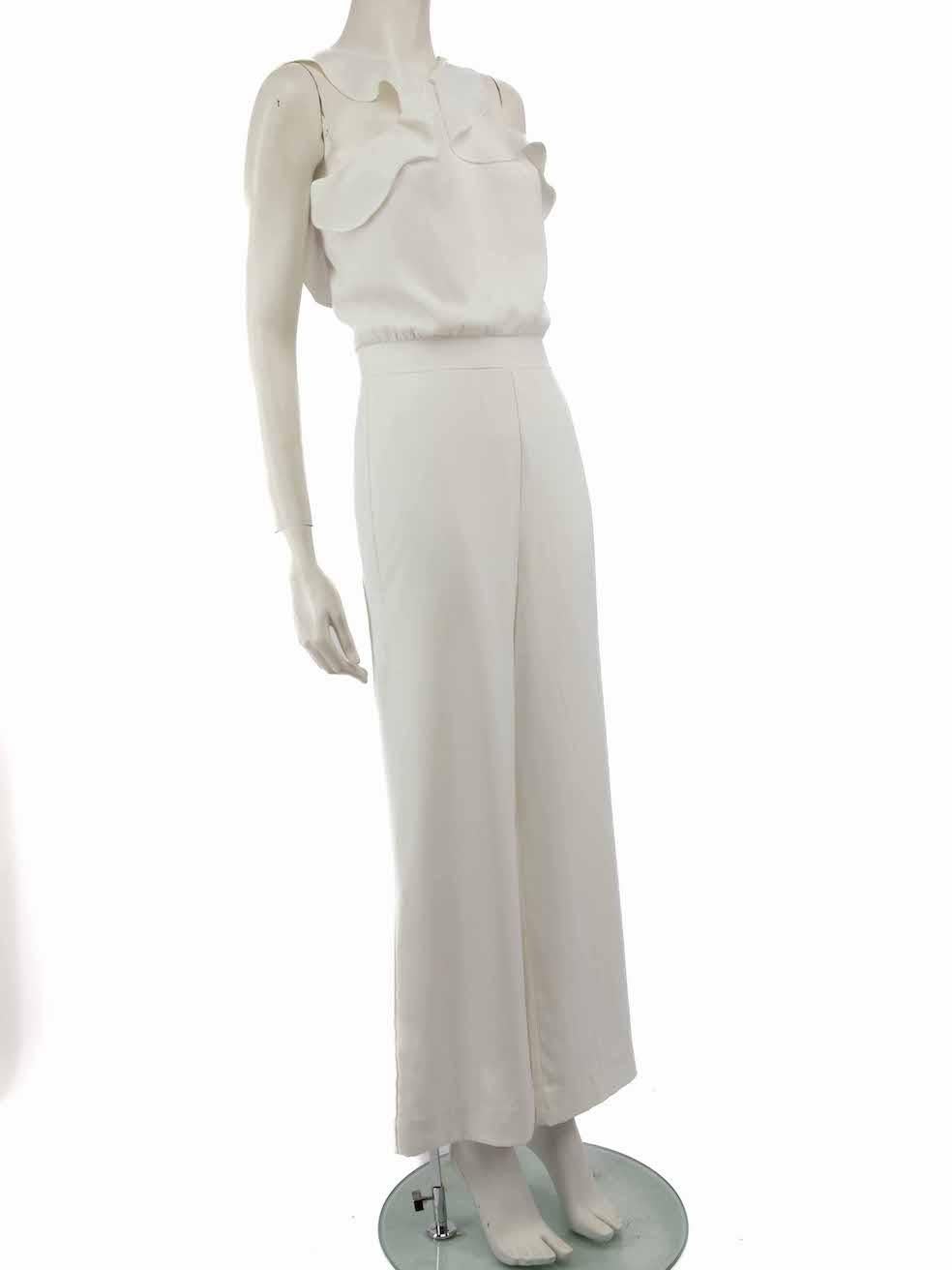 CONDITION is Good. General wear to jumpsuit is evident. Moderate signs of discoloured marks to ruffles, front waistline, front right leg, back waist and back of both legs. The eye of the back fastening and composition label is missing on this used