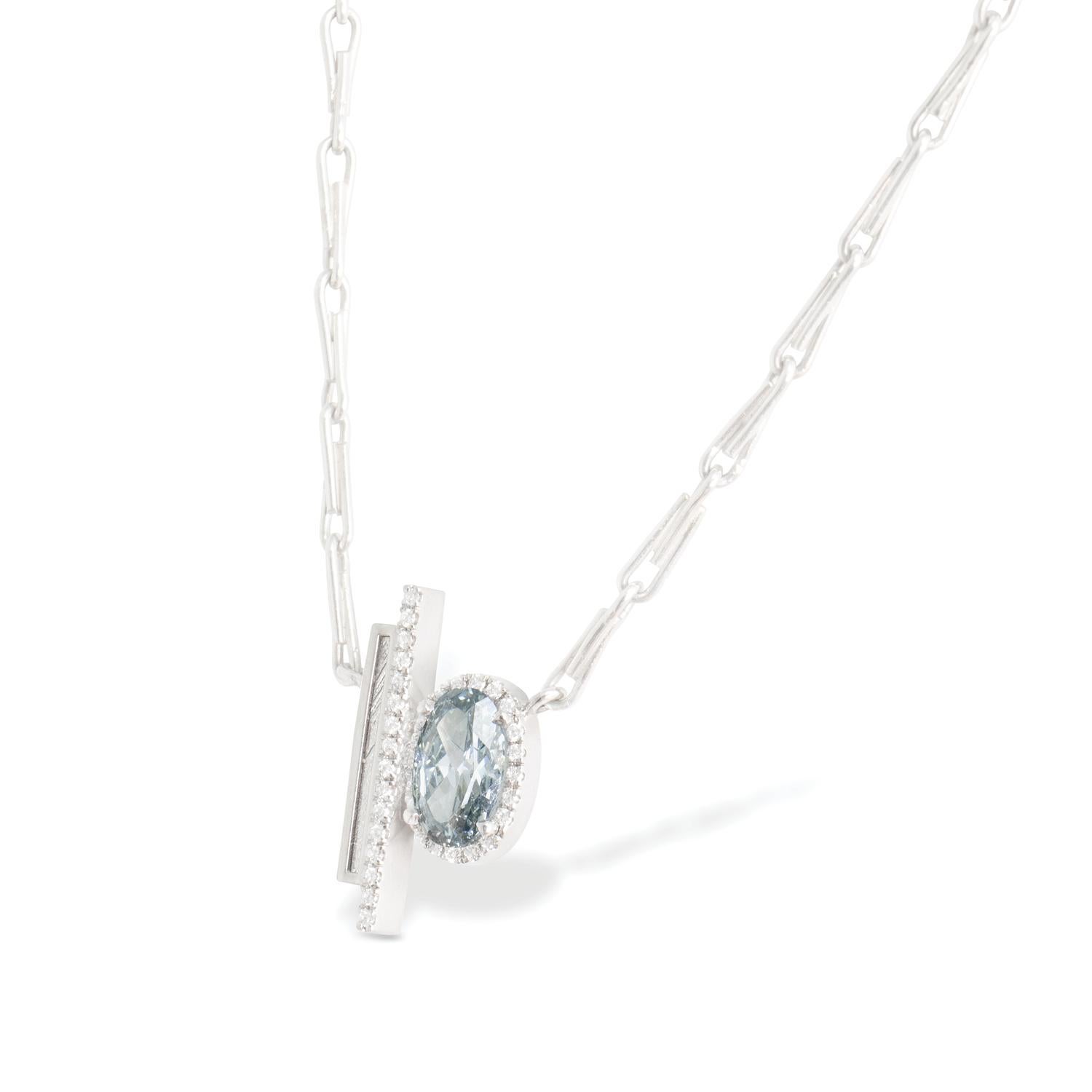 0.72 carat and Widmanstätten pattern meteorite slice necklace with white diamond pavé, recycled platinum, 0.85 TCW  - One-of-a-kind

A spectacularly rare natural fancy grayish blue oval brilliant cut diamond is poised in pavé-set white diamonds and