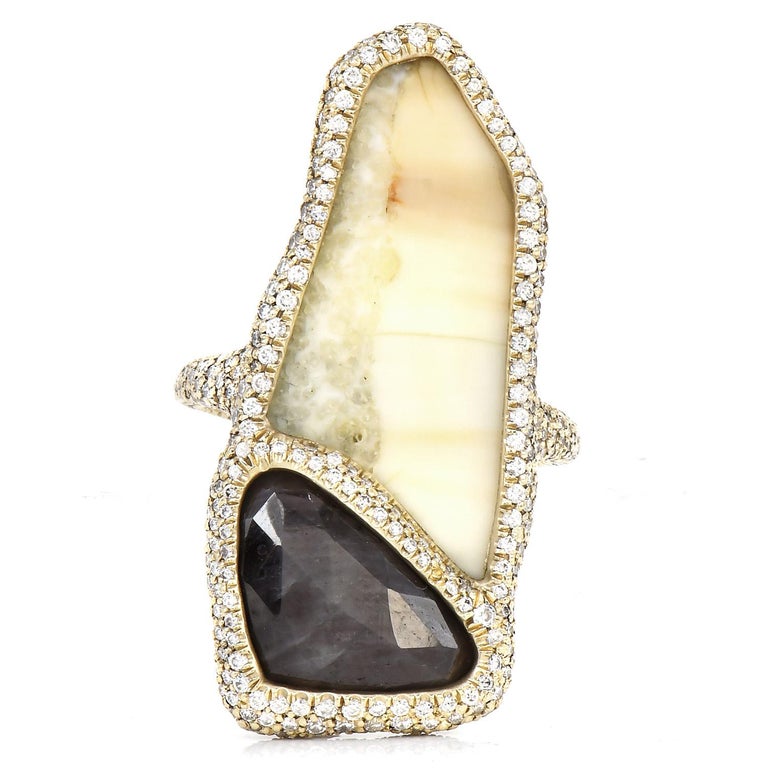 From the sustainable one-of-a-kind Designer Monique Péan, who sources her materials from the most unique places and resources.

This exquisite piece presents a center gemstone, from ombré-colored polished cabochon oval-shaped, genuine Fossilized