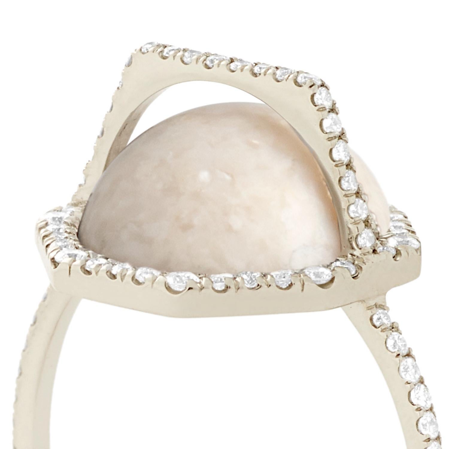 Cream fossilized dinosaur bone arch ring with white diamond pavé, 18 carat recycled white gold, 0.45 TCW 

The cream hues of this specimen of fossilized dinosaur bone are accented by  white diamond pavé that traces the outline of this ring and