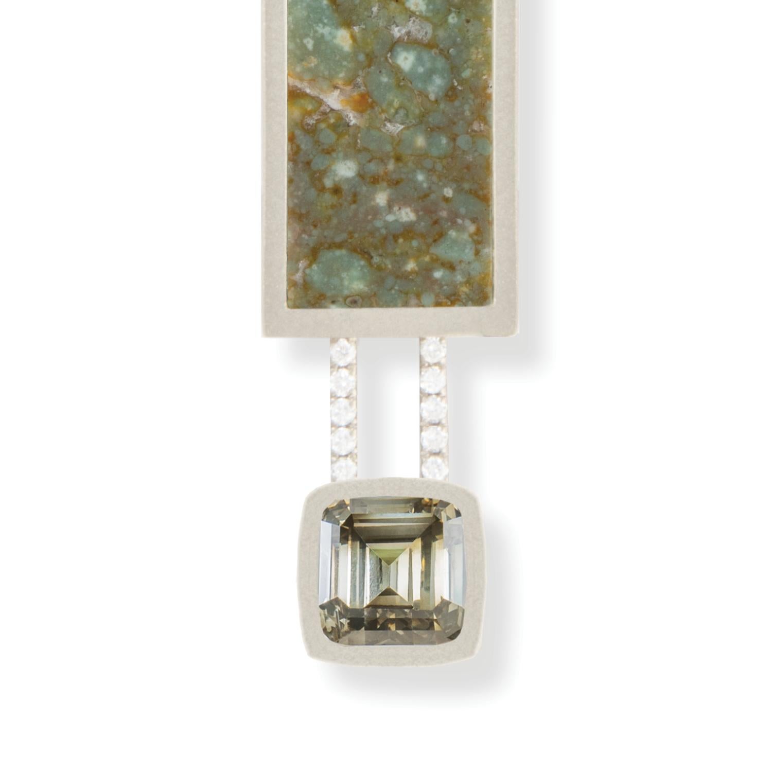 1.20 carat fancy greenish yellow-brown emerald cut diamond and emerald green fossilized dinosaur bone necklace with white diamond baguettes and white diamond pavé, 18 carat recycled white gold  - One-of-a-kind

This is a design concept that can be