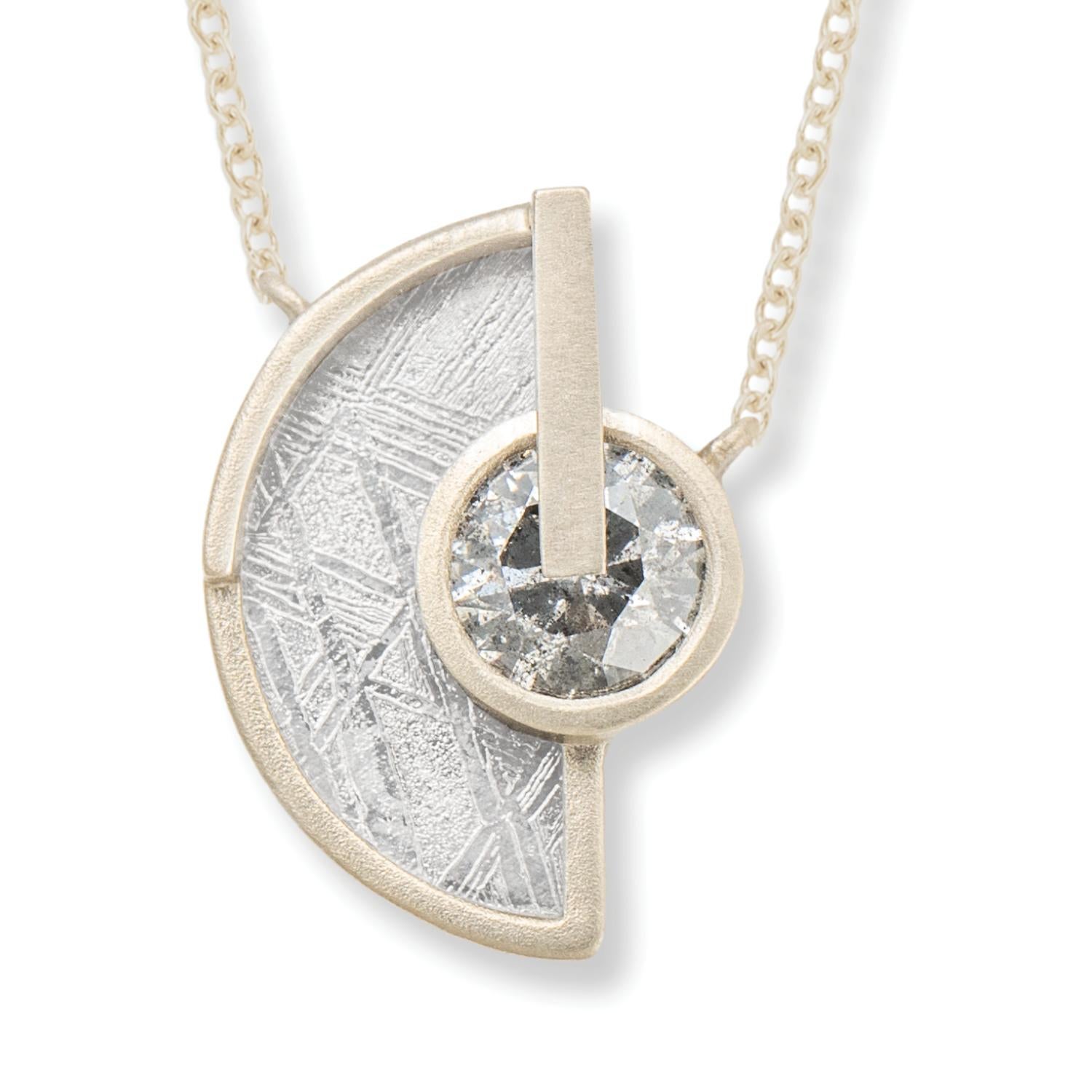 Widmanstätten pattern meteorite slice and gray semi-transparent round brilliant cut diamond arc necklace, 17 inches, 18 carat recycled white gold, 0.43 TCW  - One-of-a-kind

Inspired by the intersection of Earth and sky, this arc necklace features a