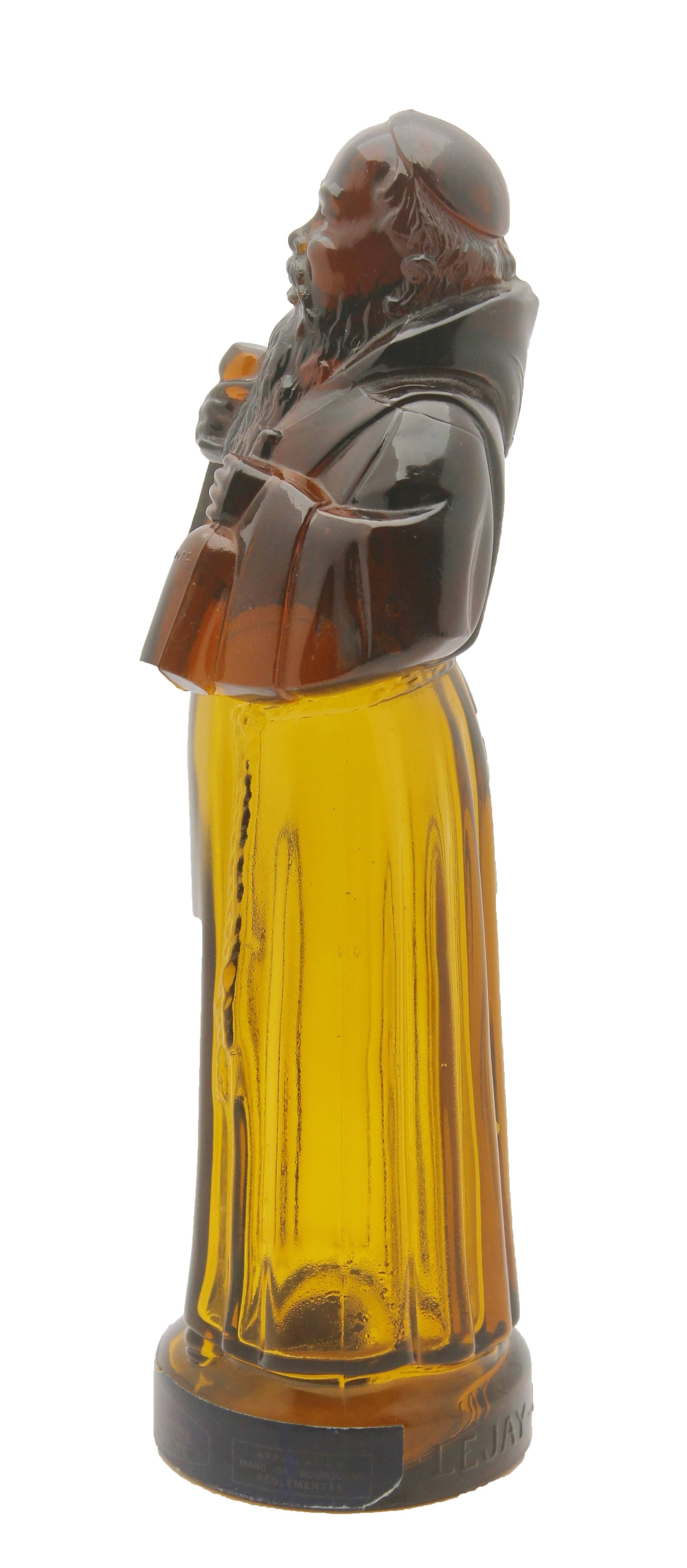 This liquor bottle or decanter was designed for 'Le Moine Legendaire' a brand owned by Lejay Lagoute .
This is now a rare survivor with the original label on the bottle that says Lejay-Lagoute Dijon-France, and the words Lejay-Lagoute pressed into