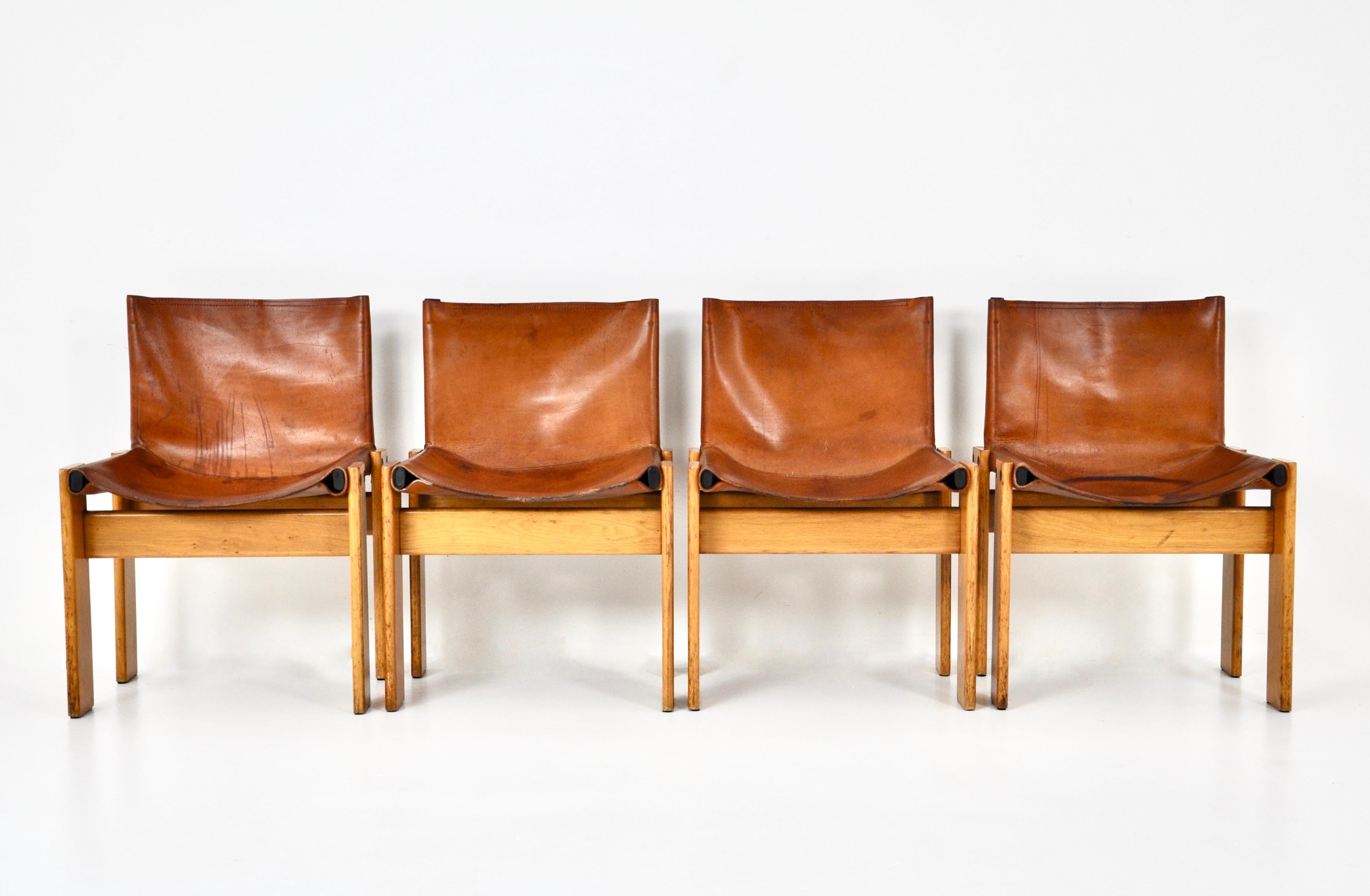 Set of 4 cognac leather and wood chairs designed by Afra & Tobia Scarpa. Model: Monk. Seat height: 40 cm. Wear due to time and age of the chairs 