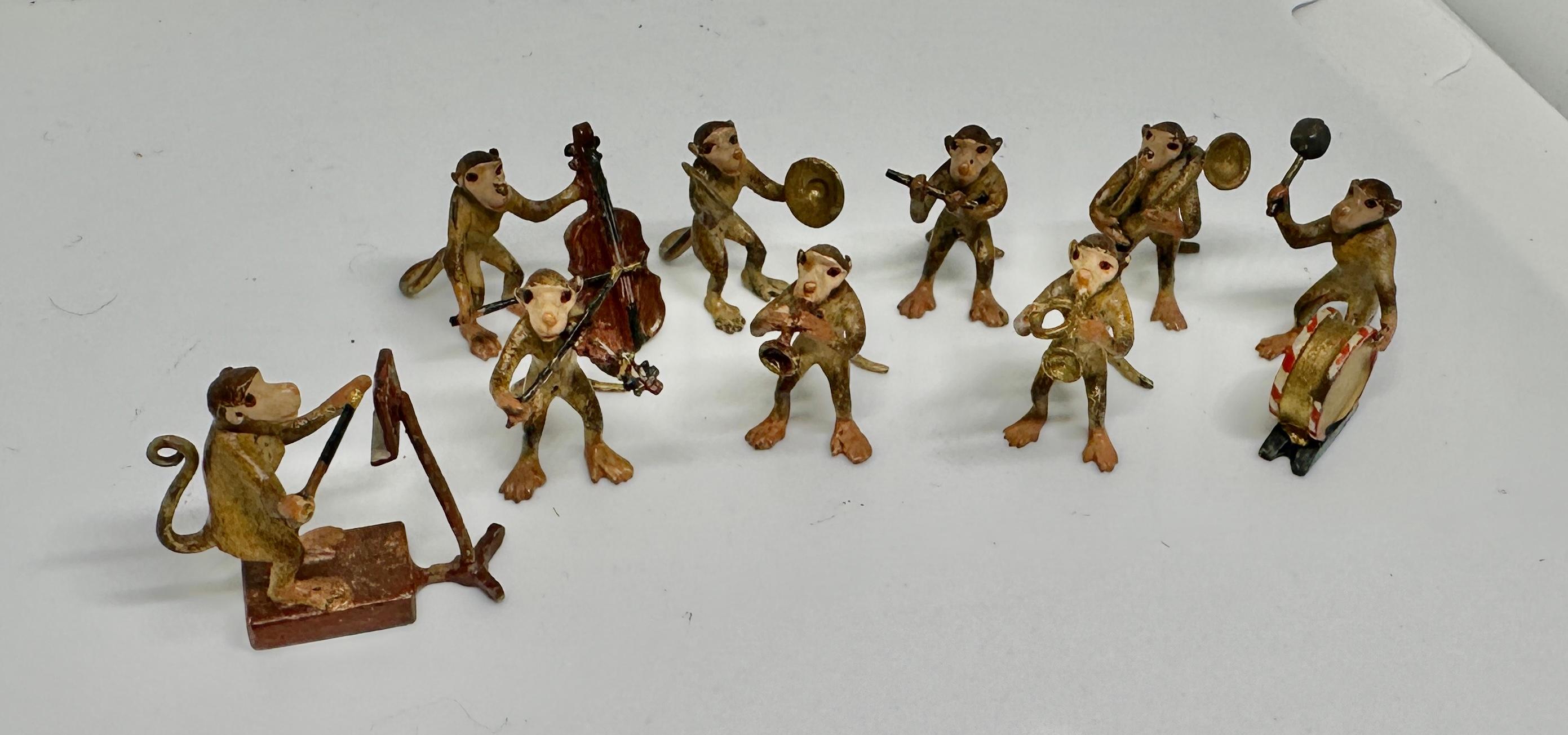 THIS IS A RARE MONKEY BAND WITH NINE PLAYERS AND CONDUCTORS.  THE MONKEY MUSICIANS ARE ANTIQUE AUSTRIAN VIENNA BRONZES.  THE BAND INCLUDES THE CONDUCTOR WITH MUSIC STAND, DRUM, VIOLIN, TRUMPET, CELLO OR BASE, CYMBALS, FRENCH HORN OR TUBA AND