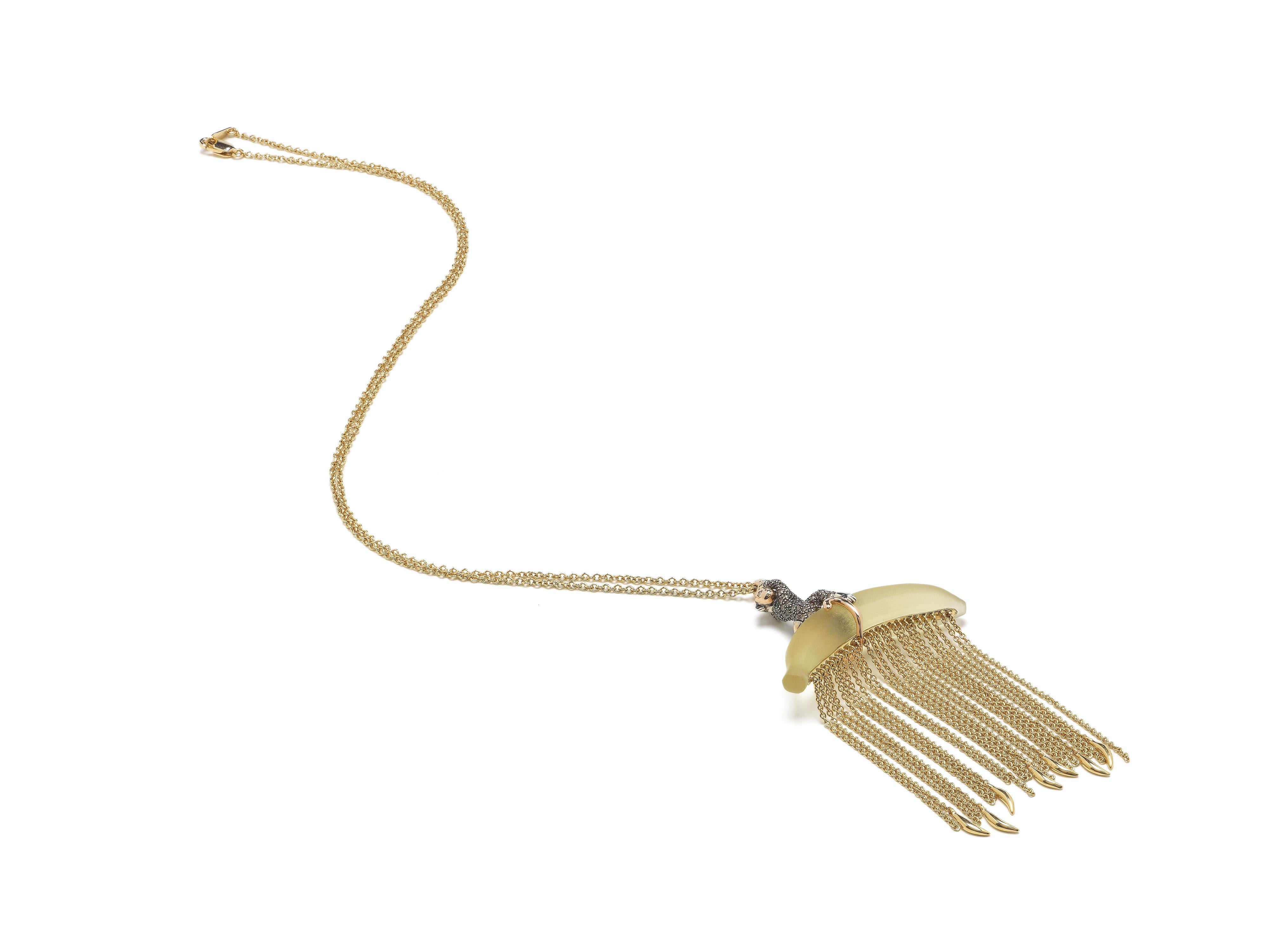 

The gold fringing on this Monkey Chain Necklace lends the piece a glamorous allure. Designed in 18k rose and yellow gold, the pendant necklace is crafted as a lemon quartz banana on which sits a monkey in rose gold and sterling silver, embellished