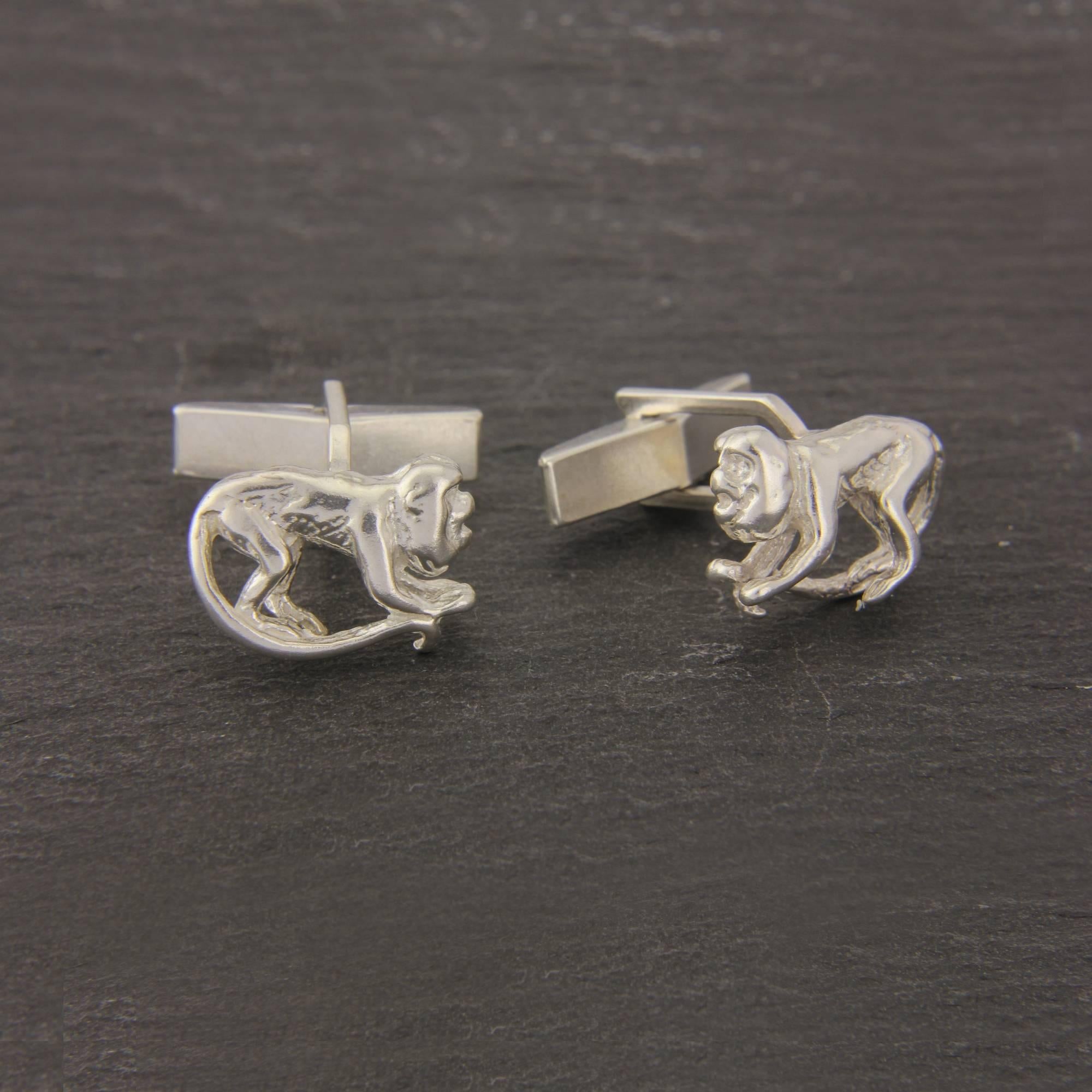 These are striking Monkey cufflinks, handmade in England, in solid Sterling Silver.
This unusual pair of cufflinks captures the essence of the lovable monkey beautifully by using a three dimensional carving .
Solid Sterling Silver high grade swivels