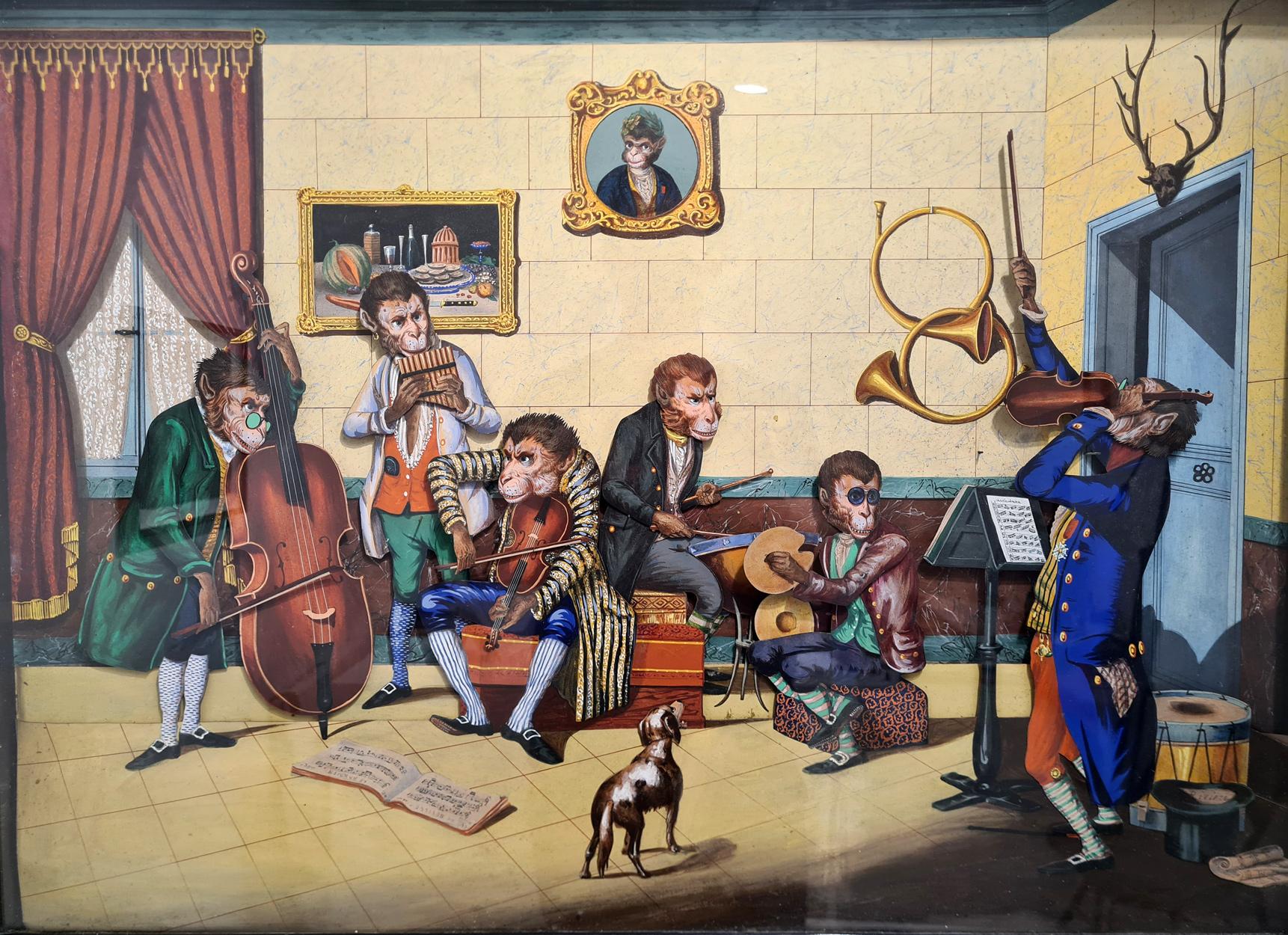 An extremely rare museum quality monkey ‘chamber orchestra’ automata musical picture, made in France in c. 1855 and signed ‘Riviere’. 

The picture is in extraordinarily good original condition, with bright vivid colours that have survived the last