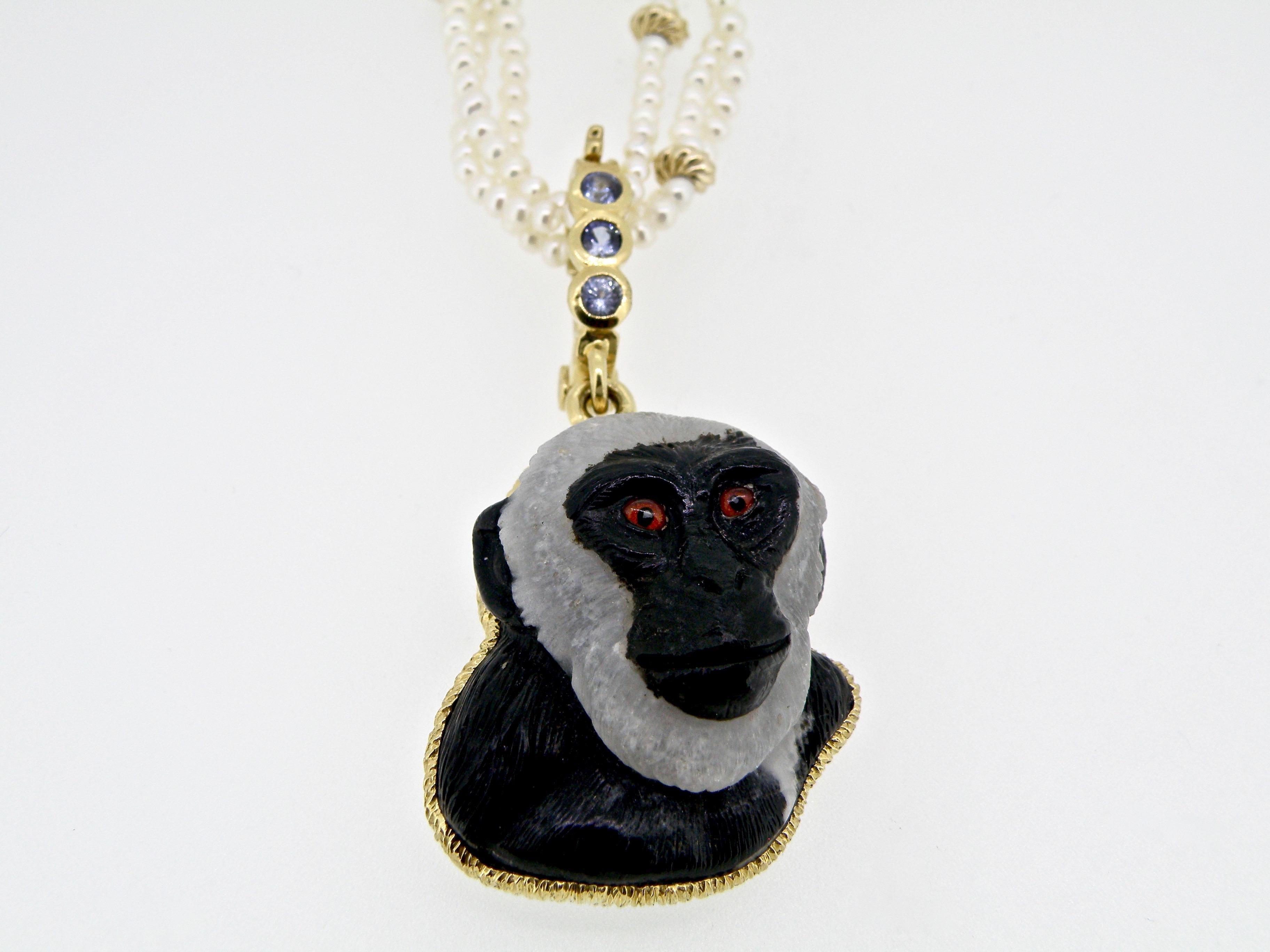 Contemporary Monkey Pendant in Gold Bezel on a Sapphire Bail