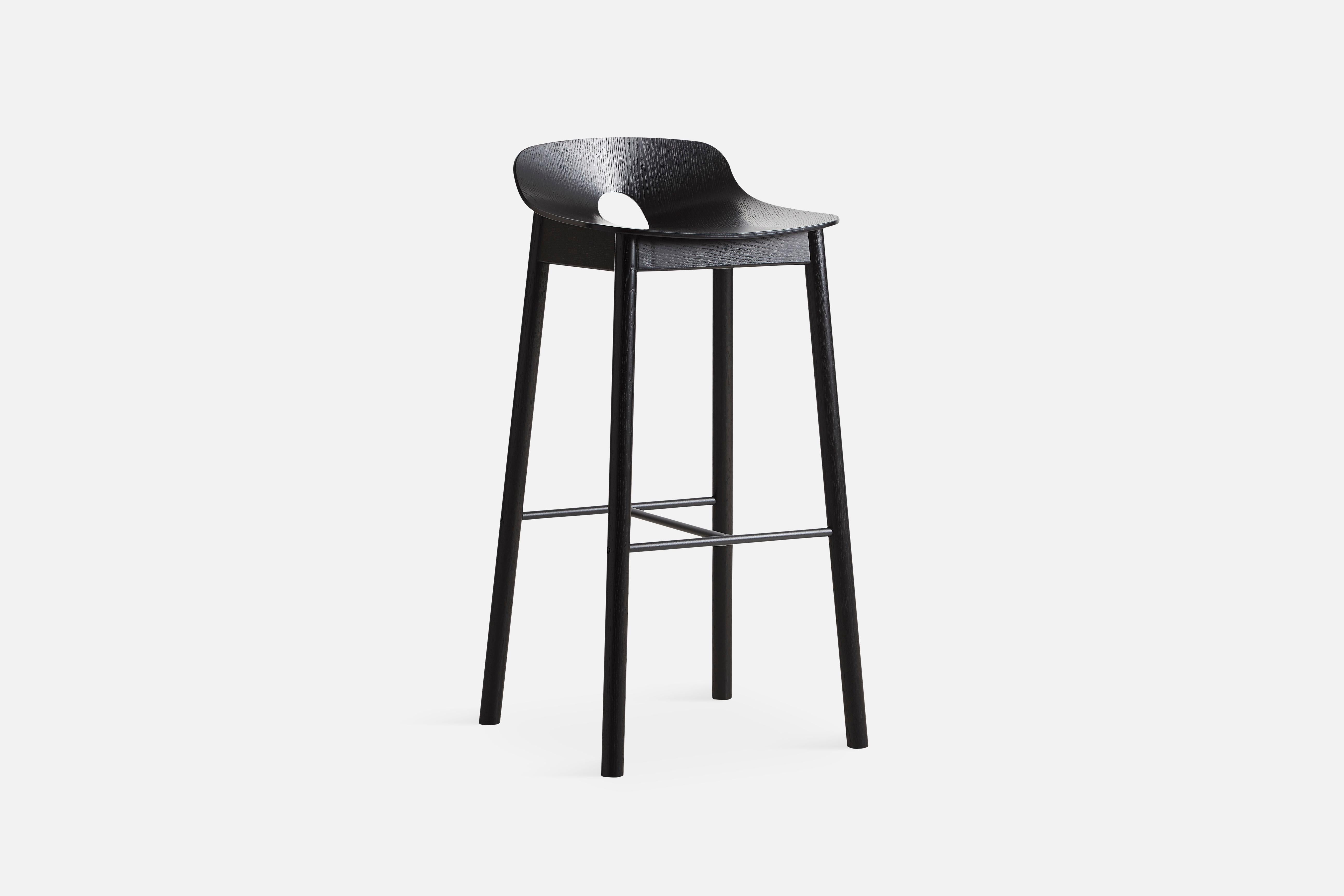 Mono bar stool by Kasper Nyman. 
Materials: Plywood with Ash Veneer.
Dimensions: D 44.7 x W 43.7 x H 87.6 cm.

The founders, Mia and Torben Koed, decided to put their 30 years of experience into a new project. It was time for a change and a new