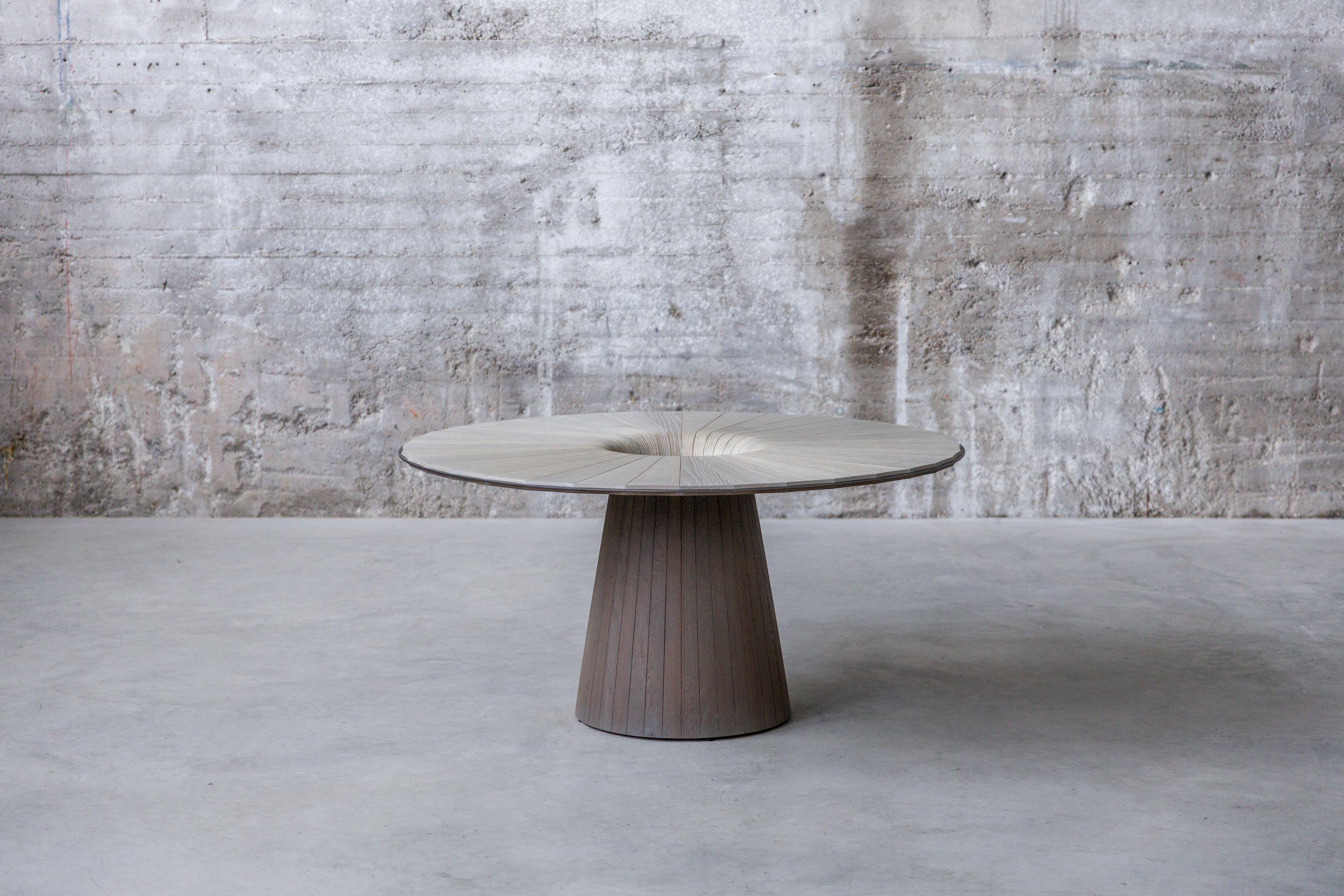 Mono Table by Christian Friedl
Limited edition of three pieces.
Dimensions: D 150 x H 74 cm.
Materials: Ash, oak.

Building a table from solid local wood without separate feet is the vision of the Creator. A wonderful story in which nature and a