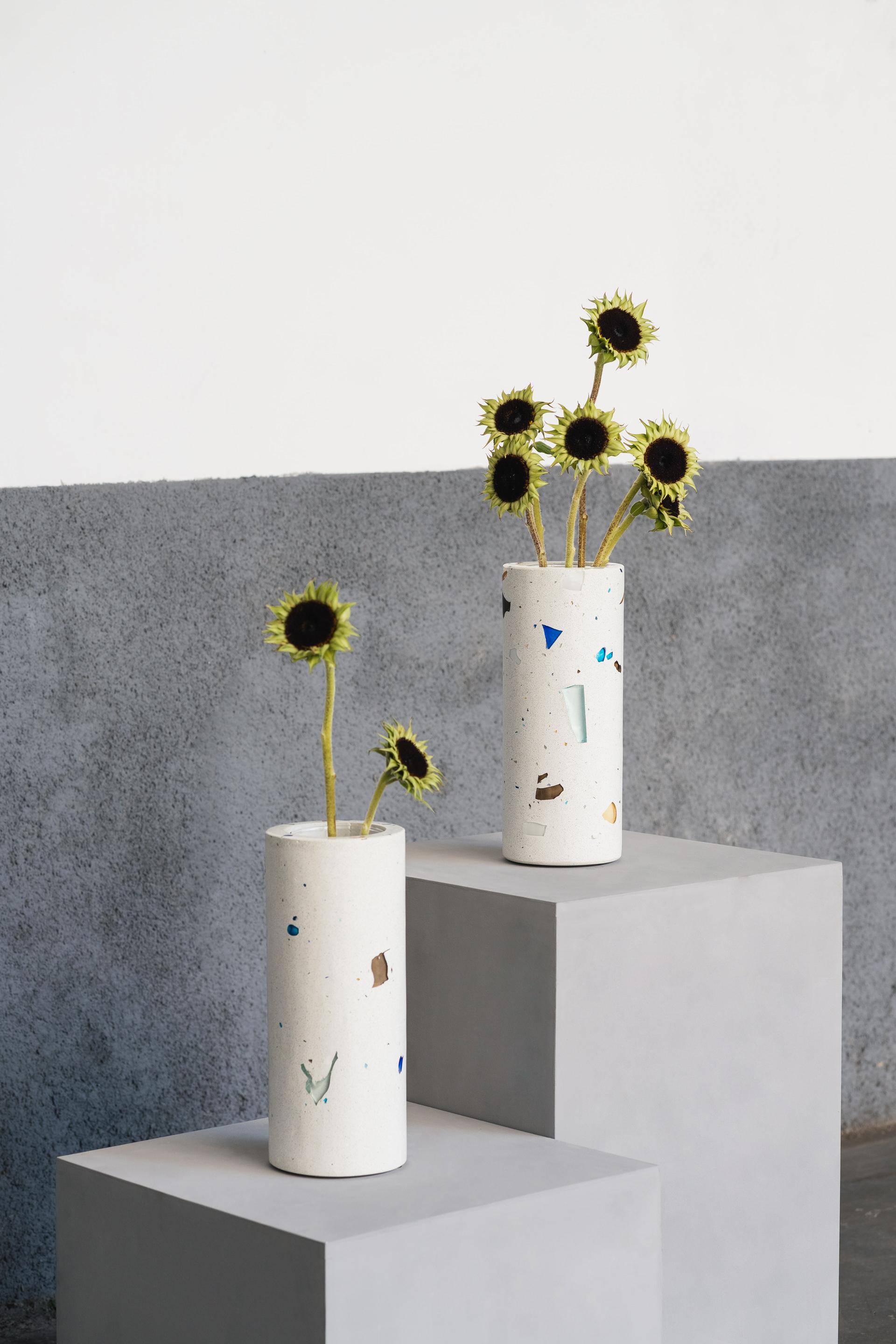 The Mono Vase takes part of the MONOMORFO collection. Its terrazzo composition is made of leftover glass crystals from a glass crystal factory in Minas Gerais, Brazil. This leftover material contributes to the creation of unique and colorful