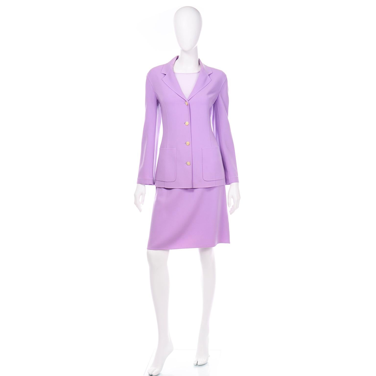 This is a such a lovely Celine lavender purple Spring and Summer weight wool monochromatic skirt suit. We love outfits like these because they are so perfect for wedding guests and for that difficult category of dressier daytime events. The blazer