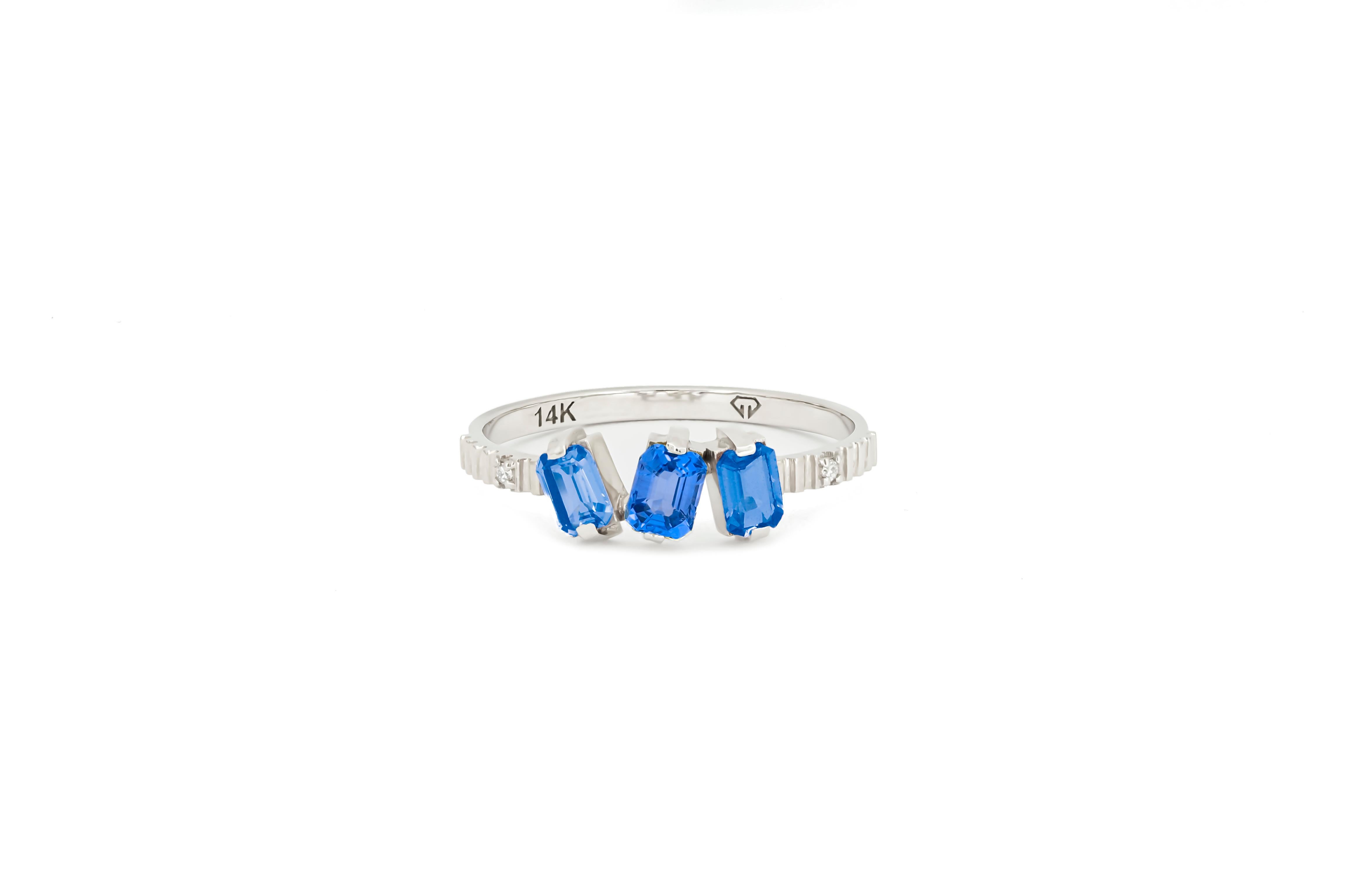 Monochrome blue gemstone 14k ring. 
Blue gemstone engagement 14k gold ring. Baguette lab sapphire gold ring. Delicate sapphire ring. Three gemstone ring.

Metal:14k gold
Weight: 2 gr depends from size.

Gemstones:
3 blue color lab sapphire ,