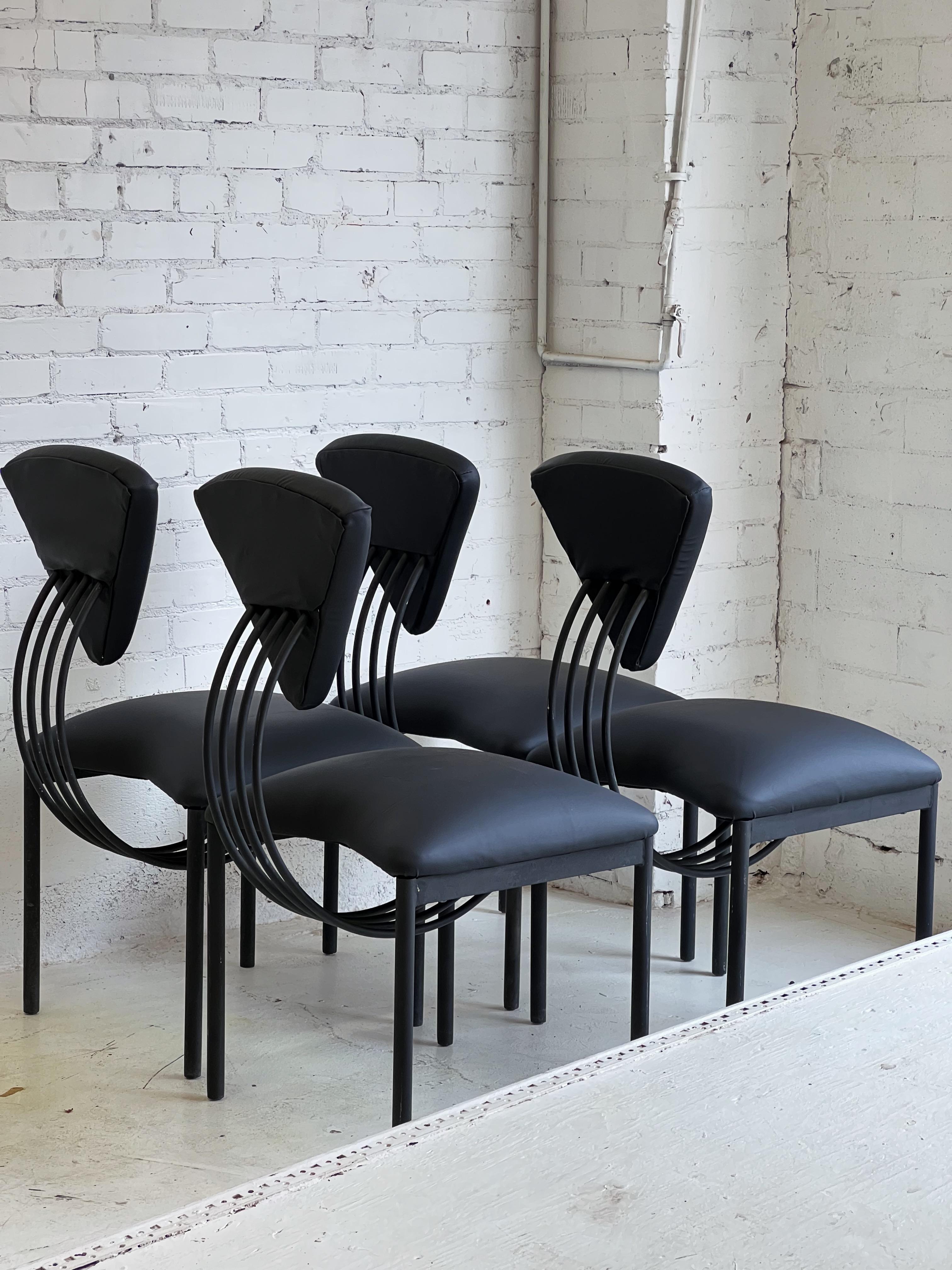 Memphis style chairs in the style of Ettore Sottsass in monochrome black.

Unmistakable silhouette with very plush cushioning; offering the rare double threat of both striking design and comfort.

Chairs are quality built and heavy. Frames are