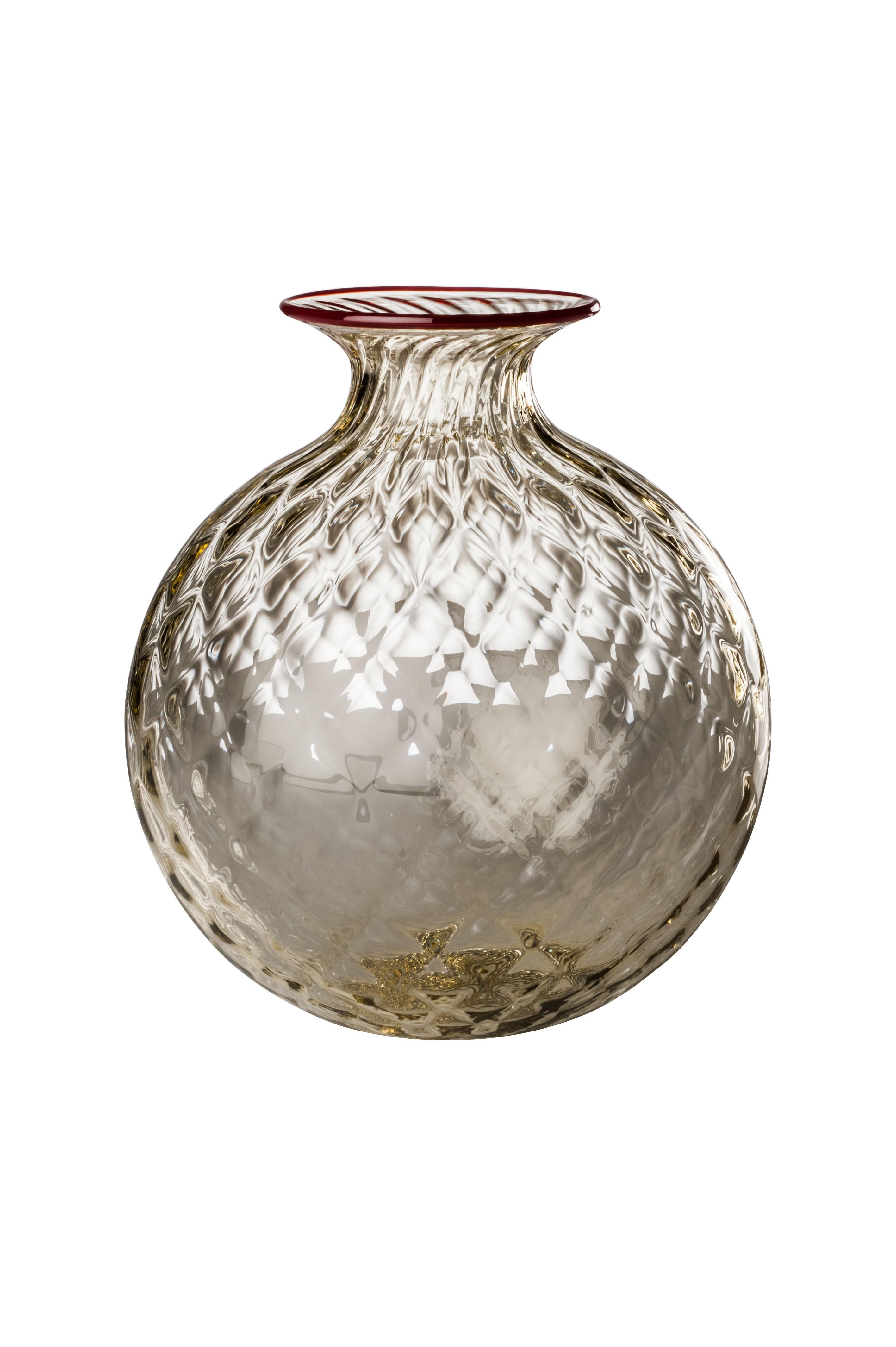Venini glass vase with full body and textured surface with hexagonal shaped pattern in pale straw designed in 1970. Perfect for indoor home decor as container or strong statement piece for any room. Also available in other colors on 1stdibs. Limited