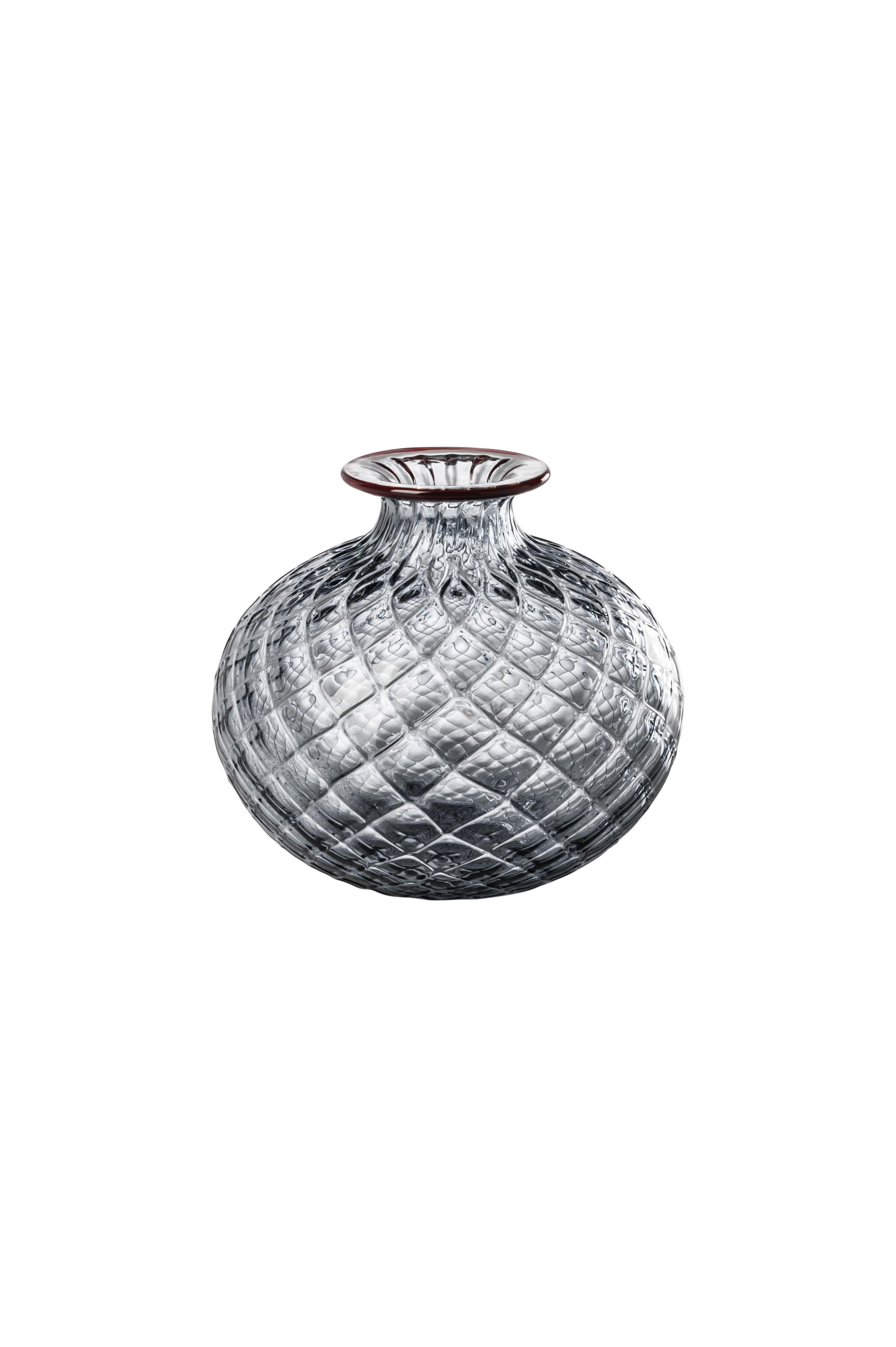 Venini glass vase with full body and textured surface with hexagonal shaped pattern in red designed in 1970. Perfect for indoor home decor as container or strong statement piece for any room. Also available in other colors on 1stdibs.

Dimensions: