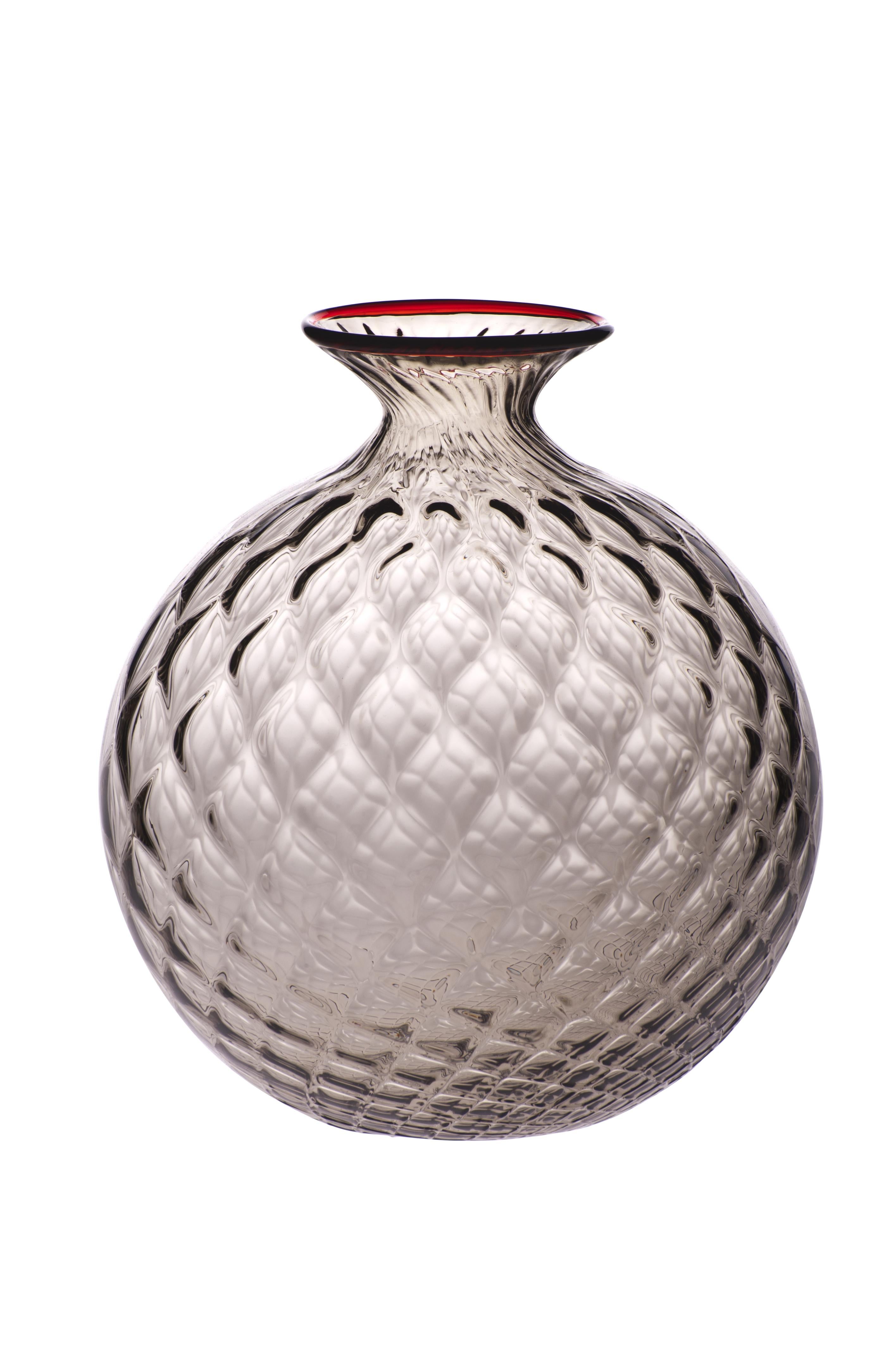 Venini glass vase with full body and textured surface with hexagonal shaped pattern in grape designed in 1970. Perfect for indoor home decor as container or strong statement piece for any room. Also available in other colors on 1stdibs. Limited