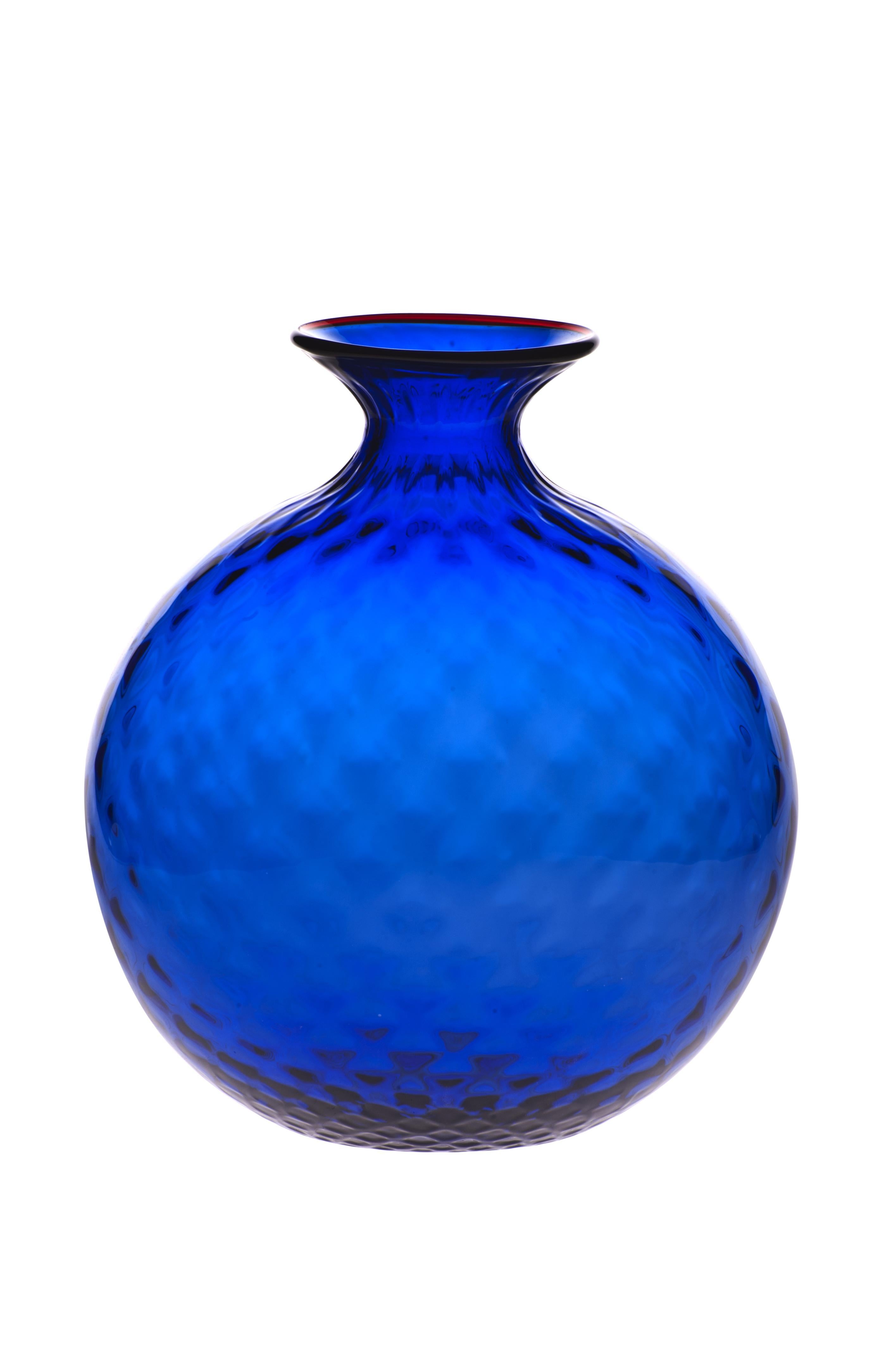 Venini glass vase with full body and textured surface with hexagonal shaped pattern in cobalt blue designed in 1970. Perfect for indoor home decor as container or strong statement piece for any room. Also available in other colors on 1stdibs.