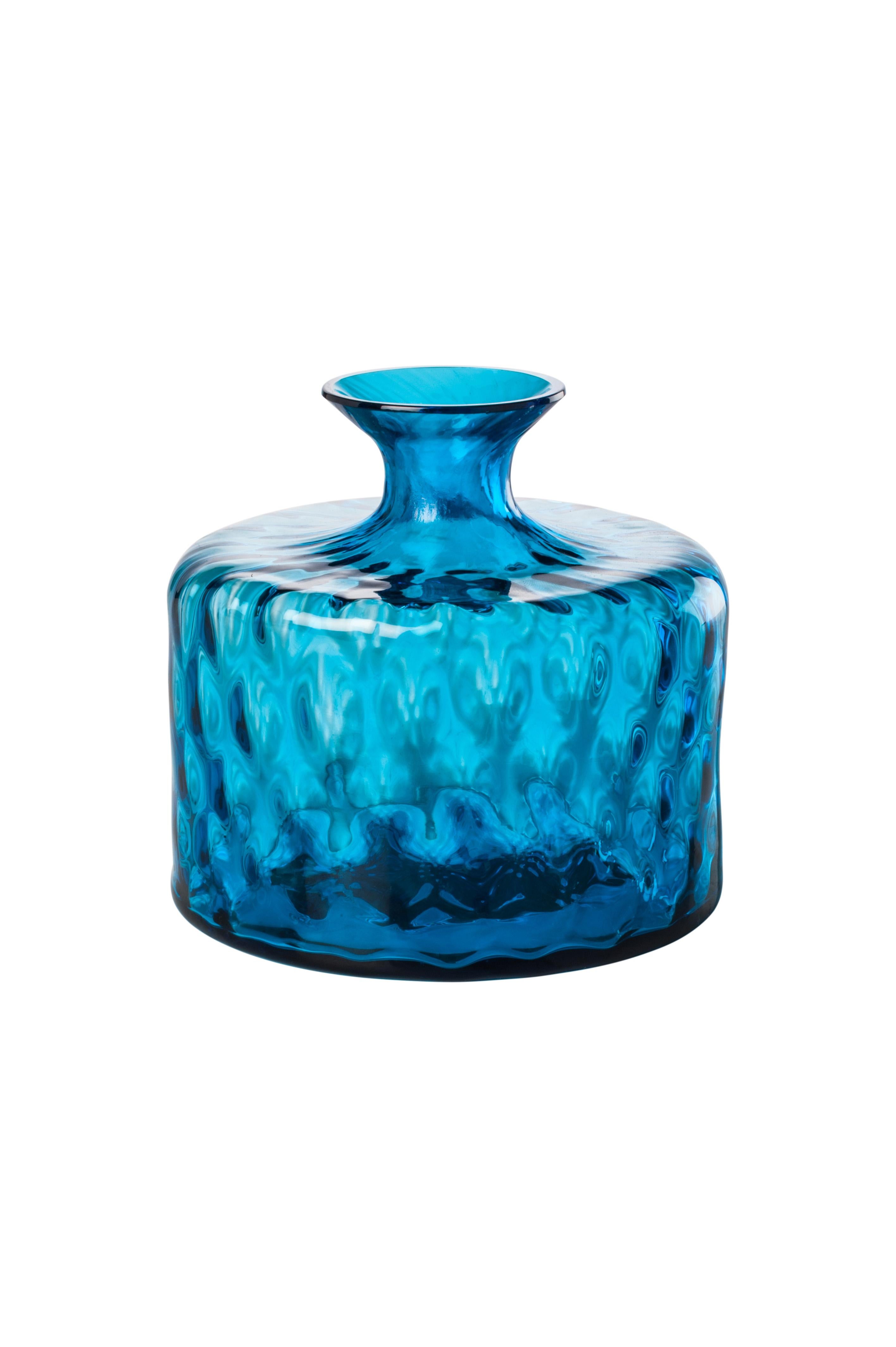 Venini glass vase with full body and thin funneled neck with textured hexagonal shaped pattern atop surface of glass in aquamarine. Featured in aquamarine colored glass and designed in 2017. Perfect for indoor home decor as container or strong