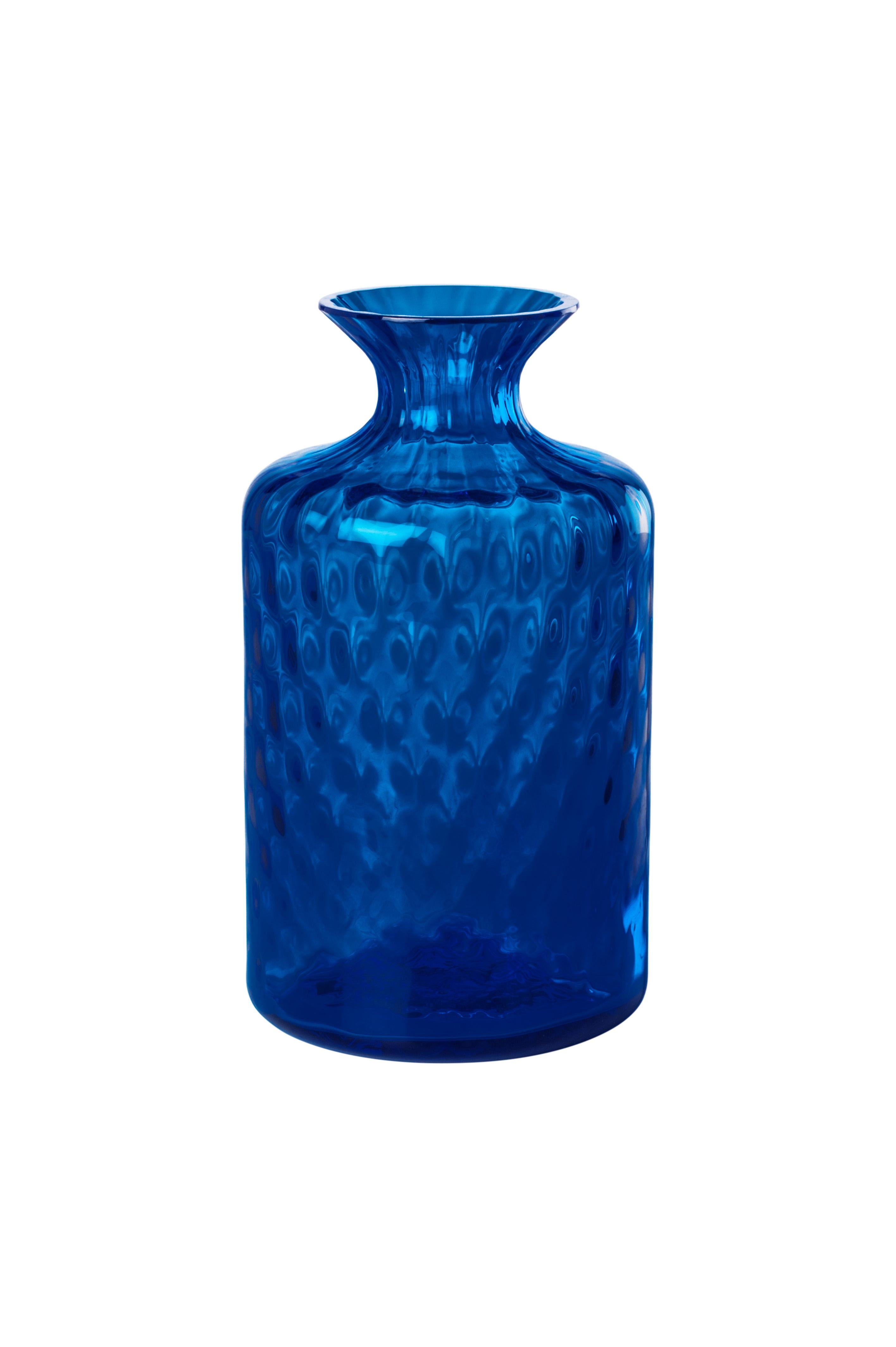 Venini glass vase with full body and thin funneled neck with textured hexagonal shaped pattern atop surface of glass in sapphire. Featured in sapphire colored glass and designed in 2017. Perfect for indoor home decor as container or strong statement