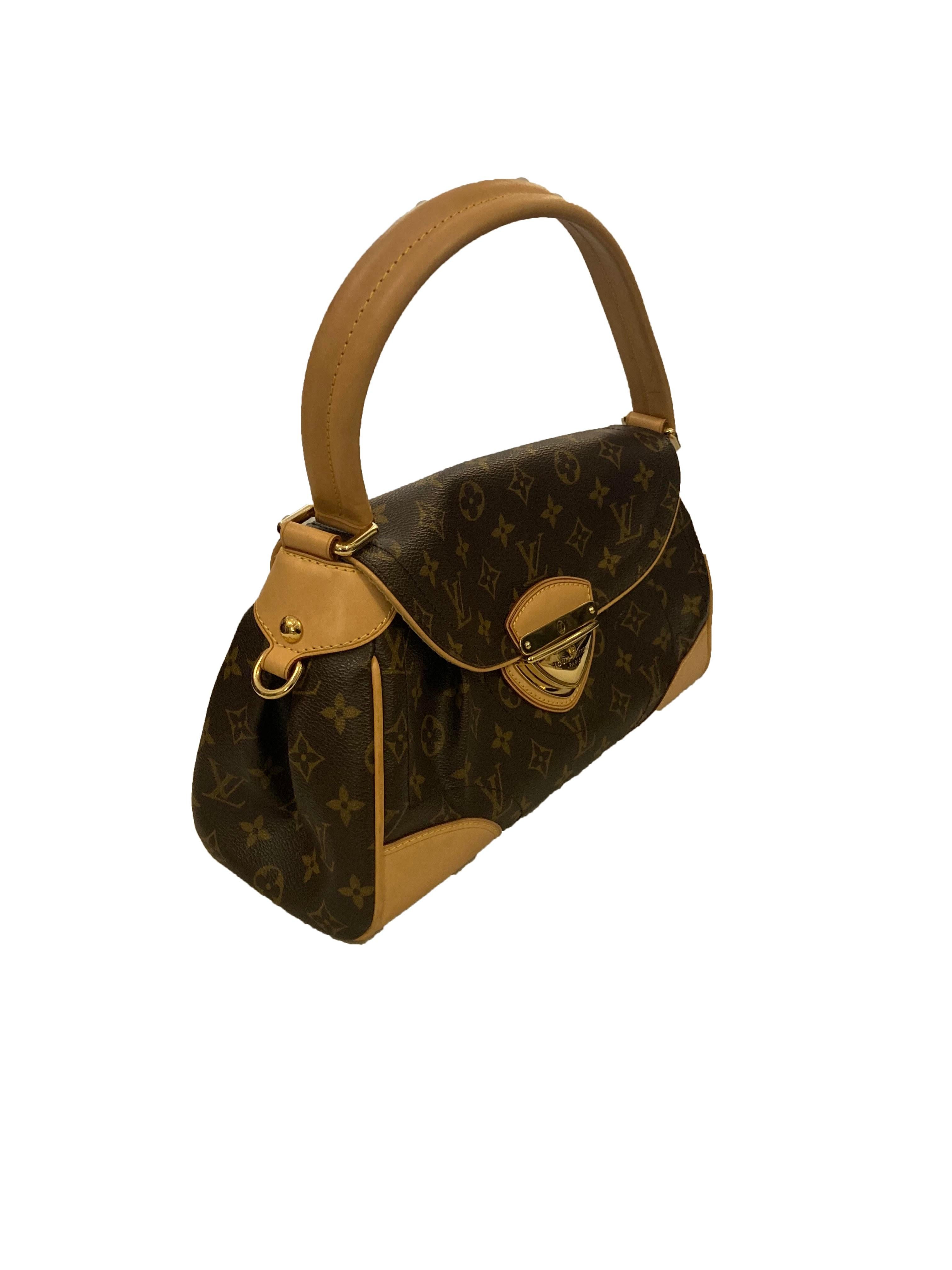 Dark brown and tan Beverly MM shoulder bag from Louis Vuitton. In signature LV monogram coated canvas with cow hide leather trim and single shoulder strap. Featuring gold toned hardware and a triangular push lock closure front and centre branded