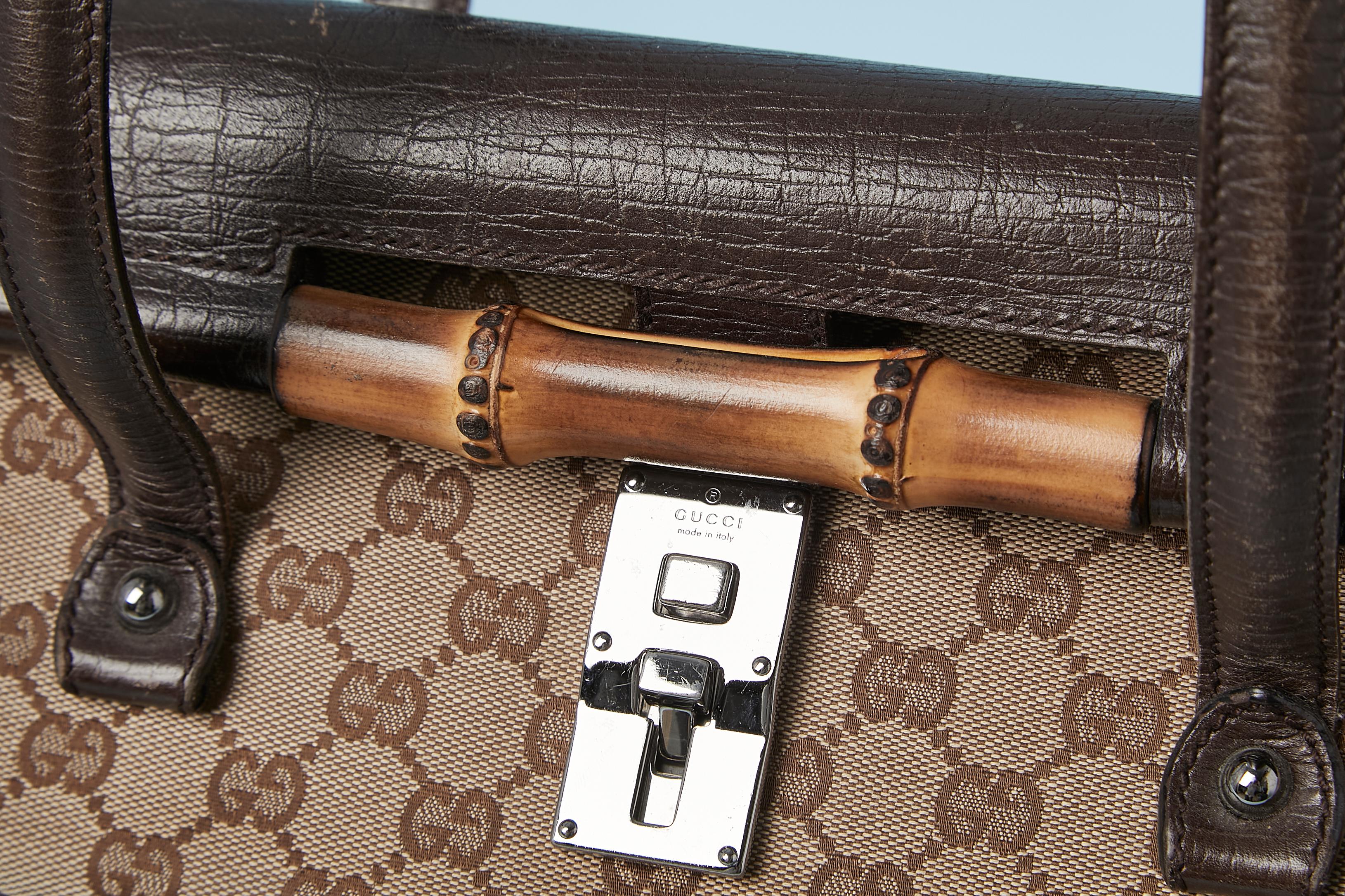 Monogram Canevas Bamboo Bullet bag. Studs . Metallic clasp. 
Size: 30 cm X 20 cm 