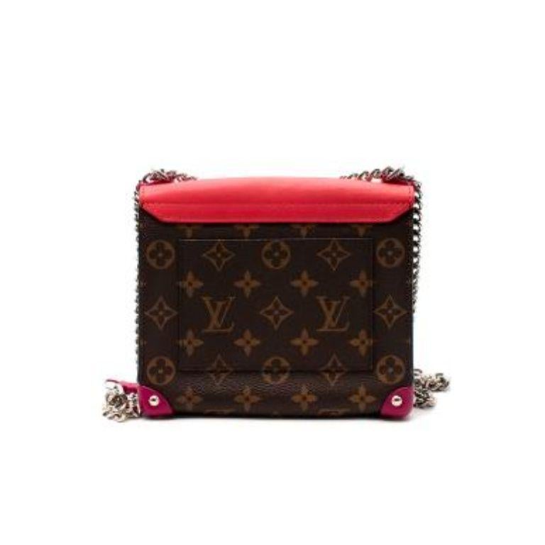 Louis Vuitton monogram canvas Pochette Mask Chain PM bag
 

 - 2015 limited edition inspired by Louis Vuitton's collection of African masks
 - Monogram canvas exterior with red Alcantara lining and flap, and pink corner accents 
 - Silver-tone metal
