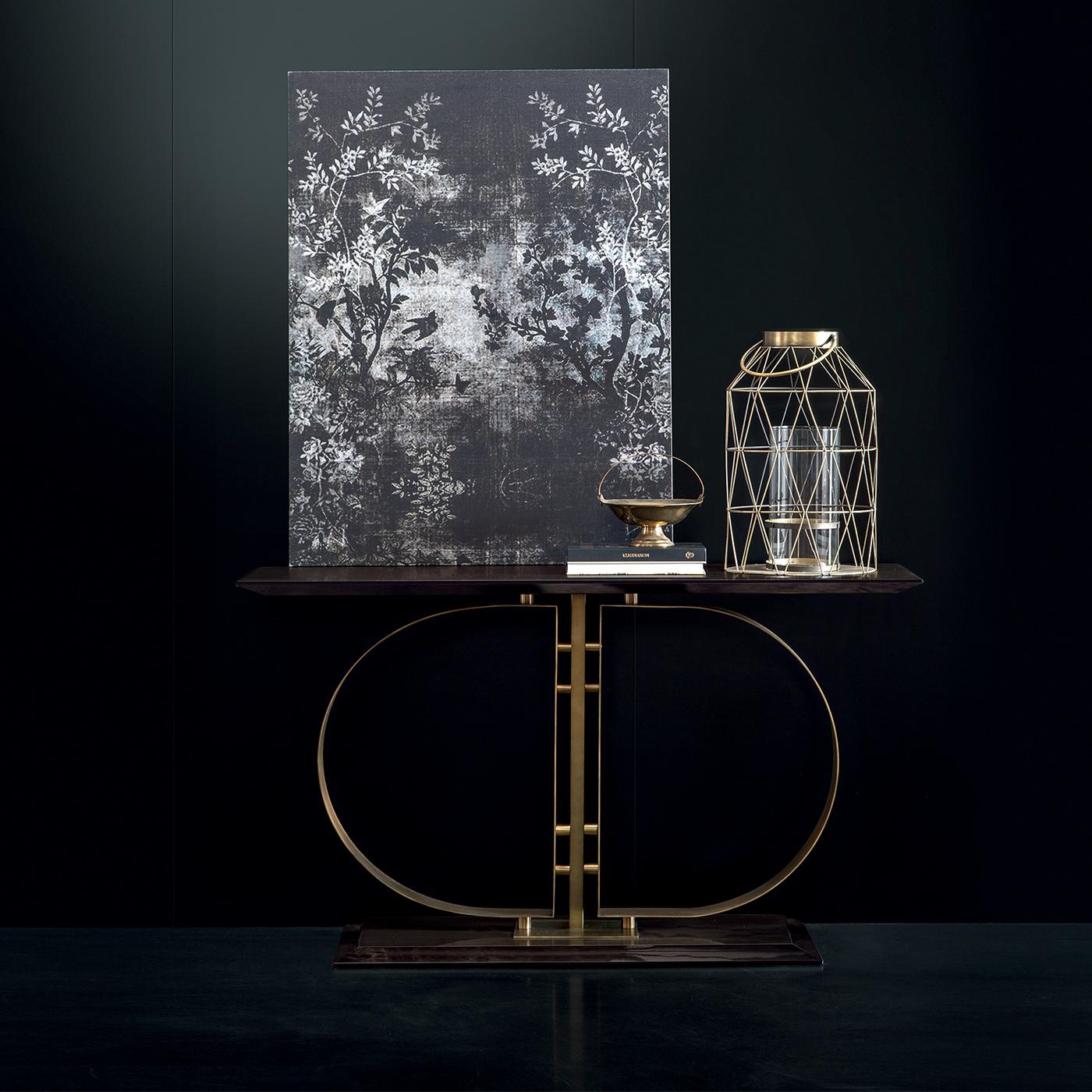 The Daytona logo takes center stage in this remarkable console. The rectangular top and base are made of plywood with a stunning smoky grey lacquered glossy finish. They stretch with a gracefully elongated silhouette to frame a visually striking