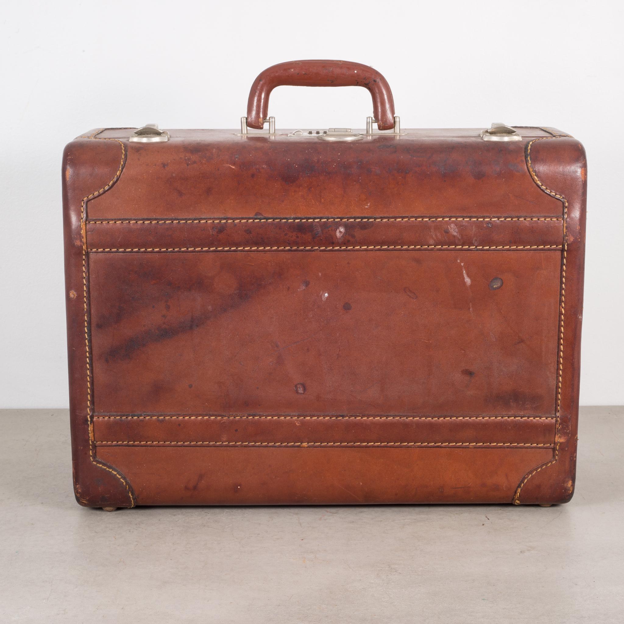 About

A small all leather suitcase with stitched corners, silver locks and a leather handle cover. The luggage is monogrammed 