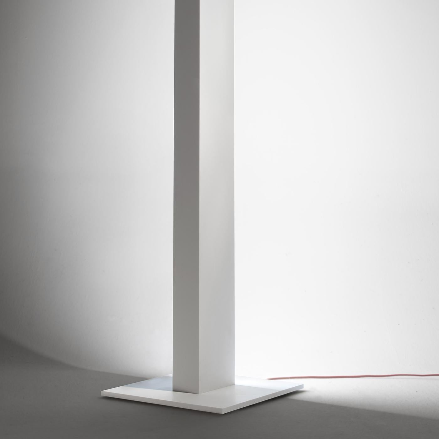 This iconic product by Luciano Pasut gives life to the essential functionality of a floor lamp, creating a sculptural masterpiece of sophistication and modernity. Handcrafted entirely in Corian, it offers an indirect light with the back functioning
