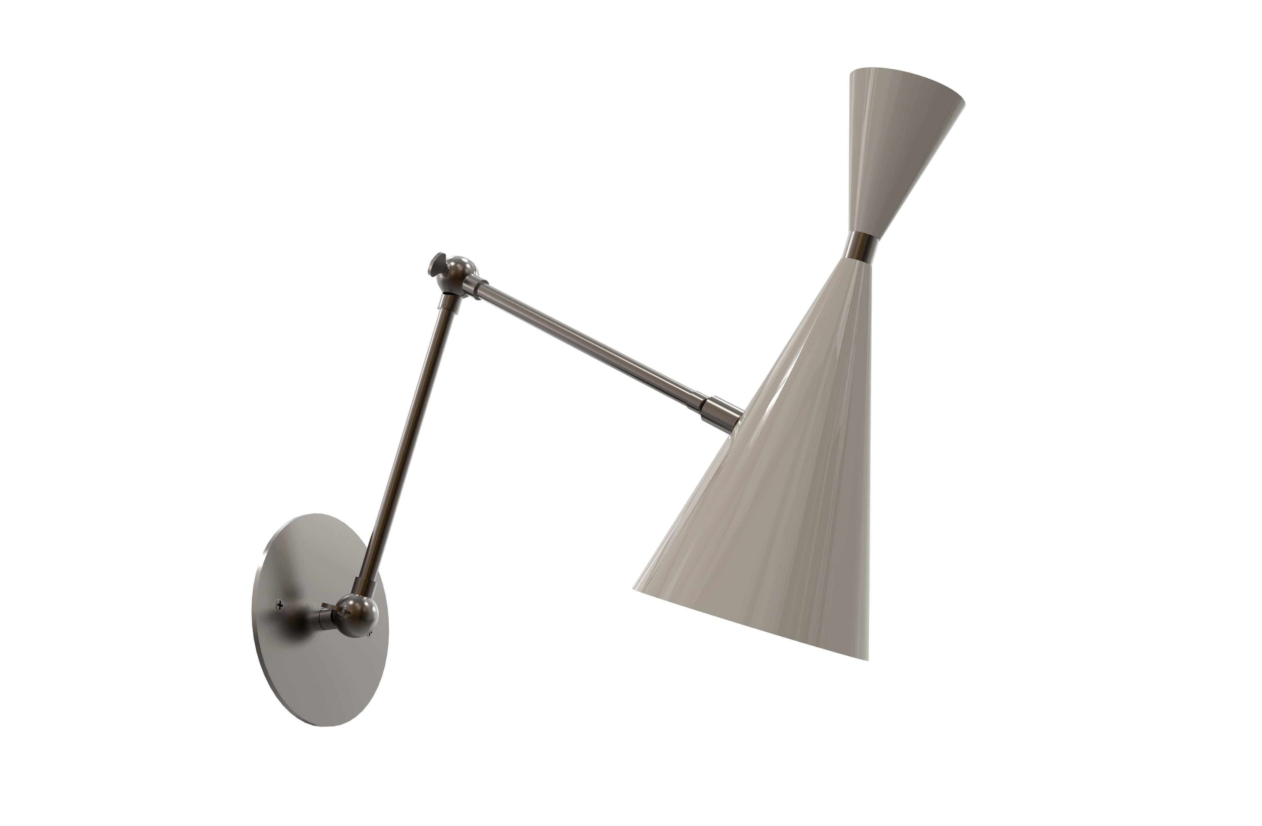 The Monolith sconce or wall-mount reading light with articulating arm and moveable head shown in satin enamel handmade by Blueprint Lighting, 2017. The spun aluminium cones are a vintage 1950s Italian design. Pivoting arm allows for height