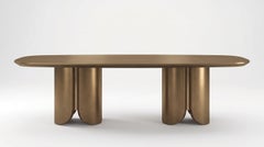 Tavolo da pranzo scultoreo monolitico in laccato bronzo satinato con dettagli in ottone