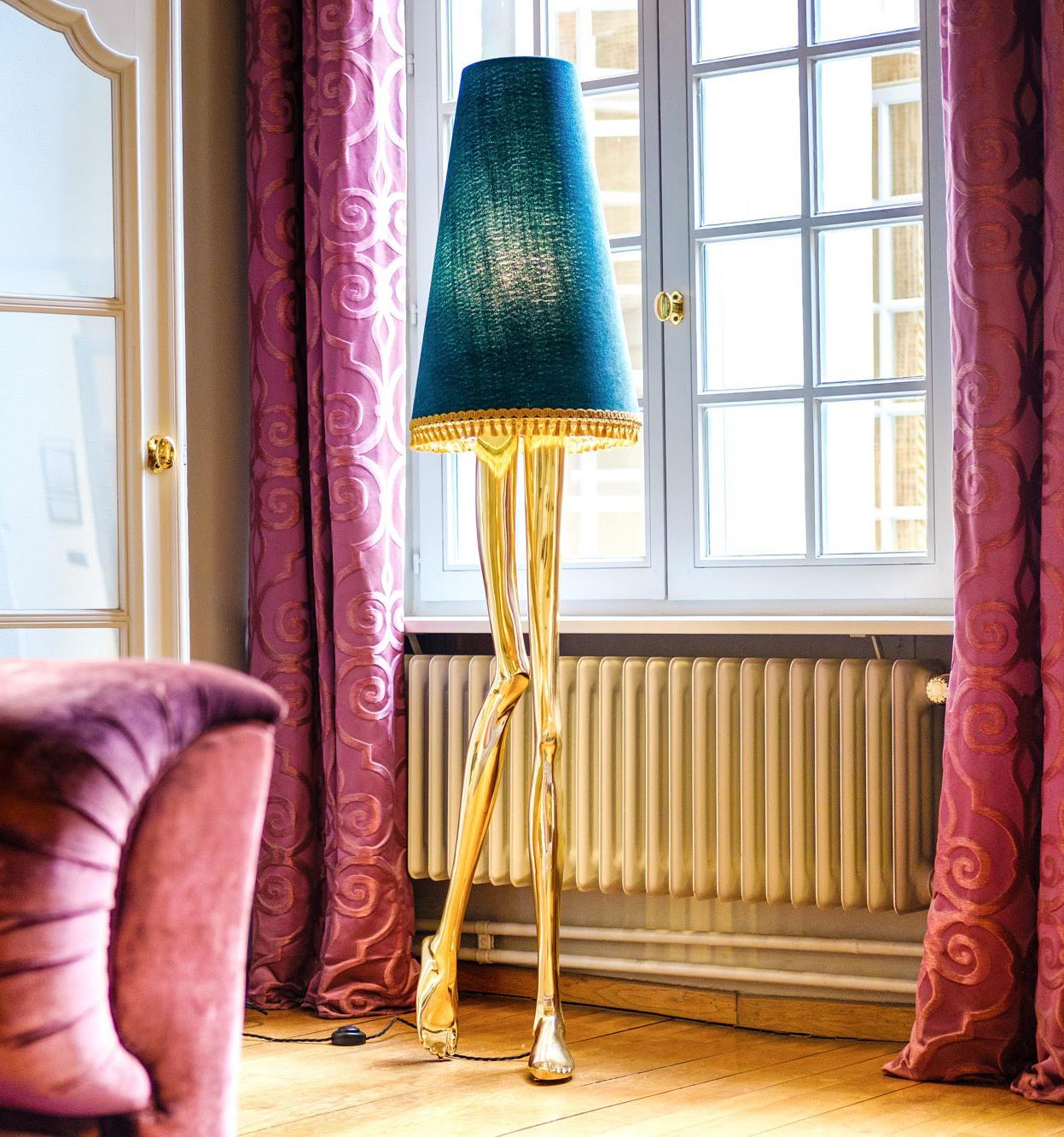 Inspiration:  
Marilyn Monroe, the sexiest Pin-up of the 1950s, inspired a piece of Art & Design. The design of the Monroe Lamp captures the essence of her image and the sensuality of her legs. The lampshade and the gold tassel fringe complement the