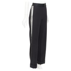 Pantaloni Monse in lana vergine nera e twill di cotone color crema con bordino con logo e gamba larga, taglia US2 S