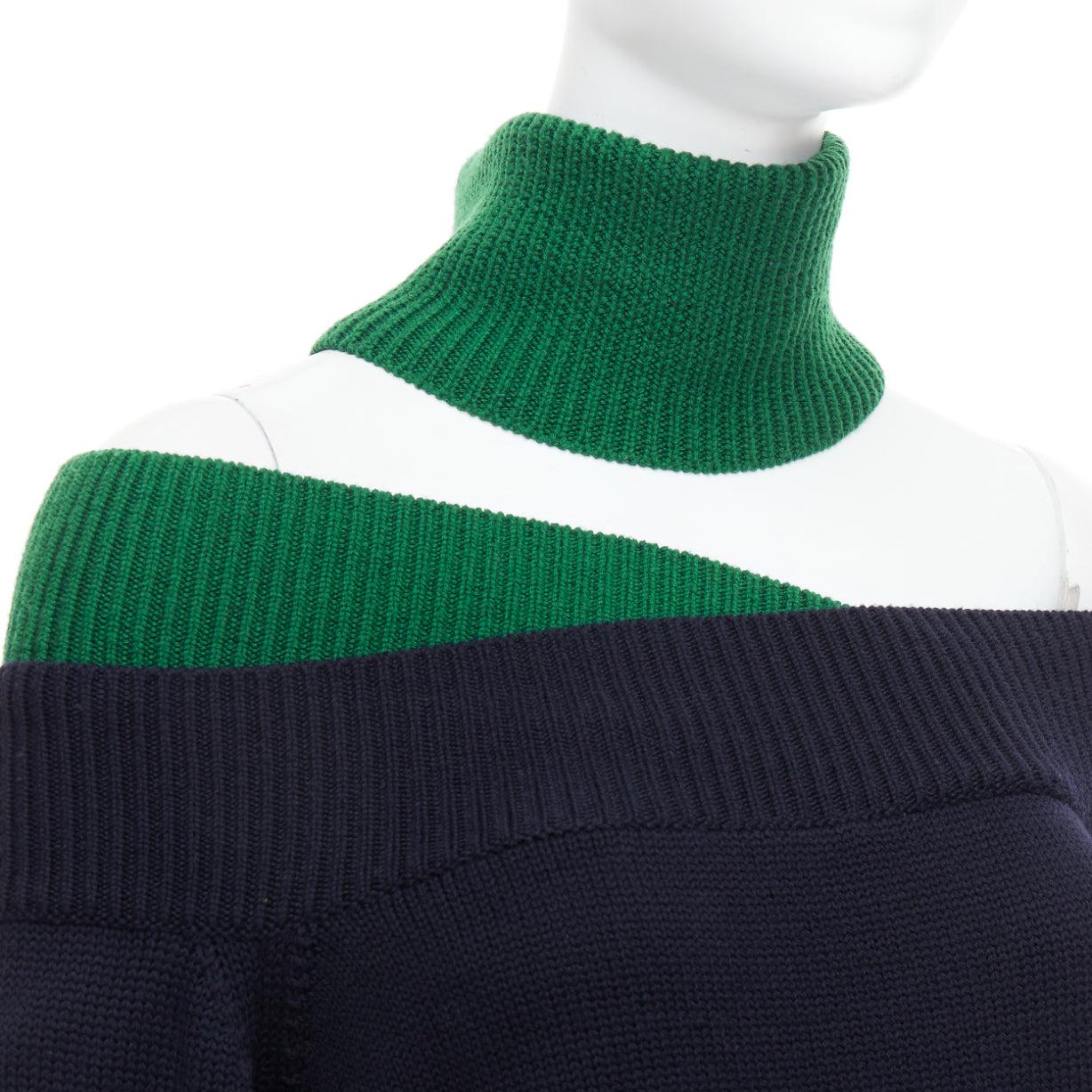 MONSE navy green merino wool asymmetric cut out  sweater S
Reference: NKLL/A00326
Brand: Monse
Material: Merino Wool, Blend
Color: Green, Navy
Pattern: Solid
Closure: Pullover

CONDITION:
Condition: Very good, this item was pre-owned and is in very