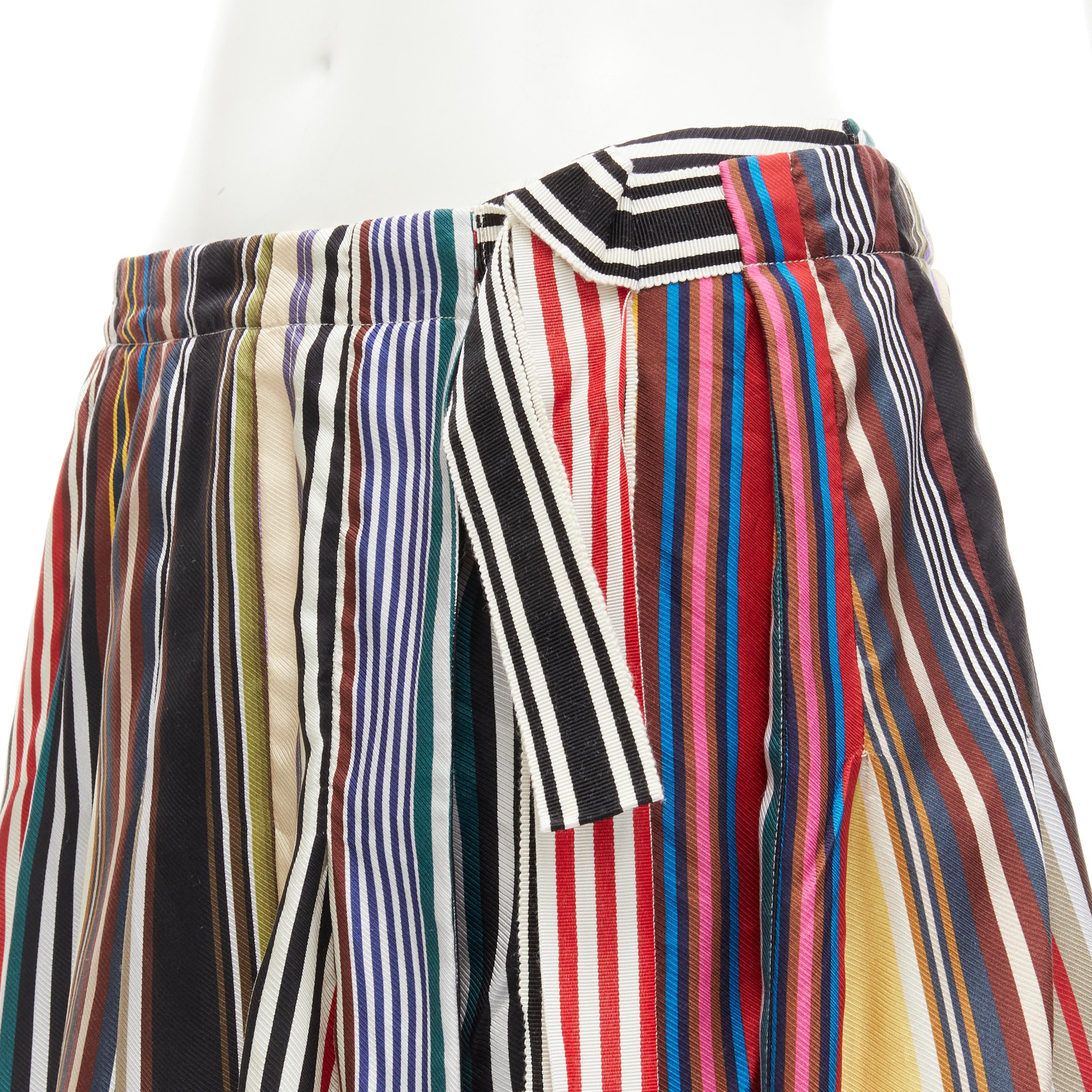 MONSE rainbow striped silk belted front asymmetric skirt US6 M
Brand: Monse
Material: Silk
Color: Multicolour
Pattern: Striped
Closure: Zip
Extra Detail: Boy shorts lining with wrap outer skirt. Self tie belt.

CONDITION:
Condition: Excellent, this