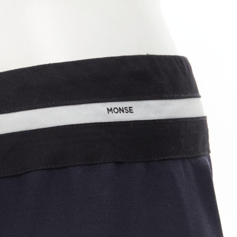 MONSE Runway mixed navy grey patchwork asymmetric skirt US4 S
Reference: KNLM/A00197
Brand: Monse
Designer: Laura Kim and Fernando Garcia
Collection: Runway
Material: Wool, Blend
Color: Navy, Grey
Pattern: Solid
Extra Details: Logo trim at