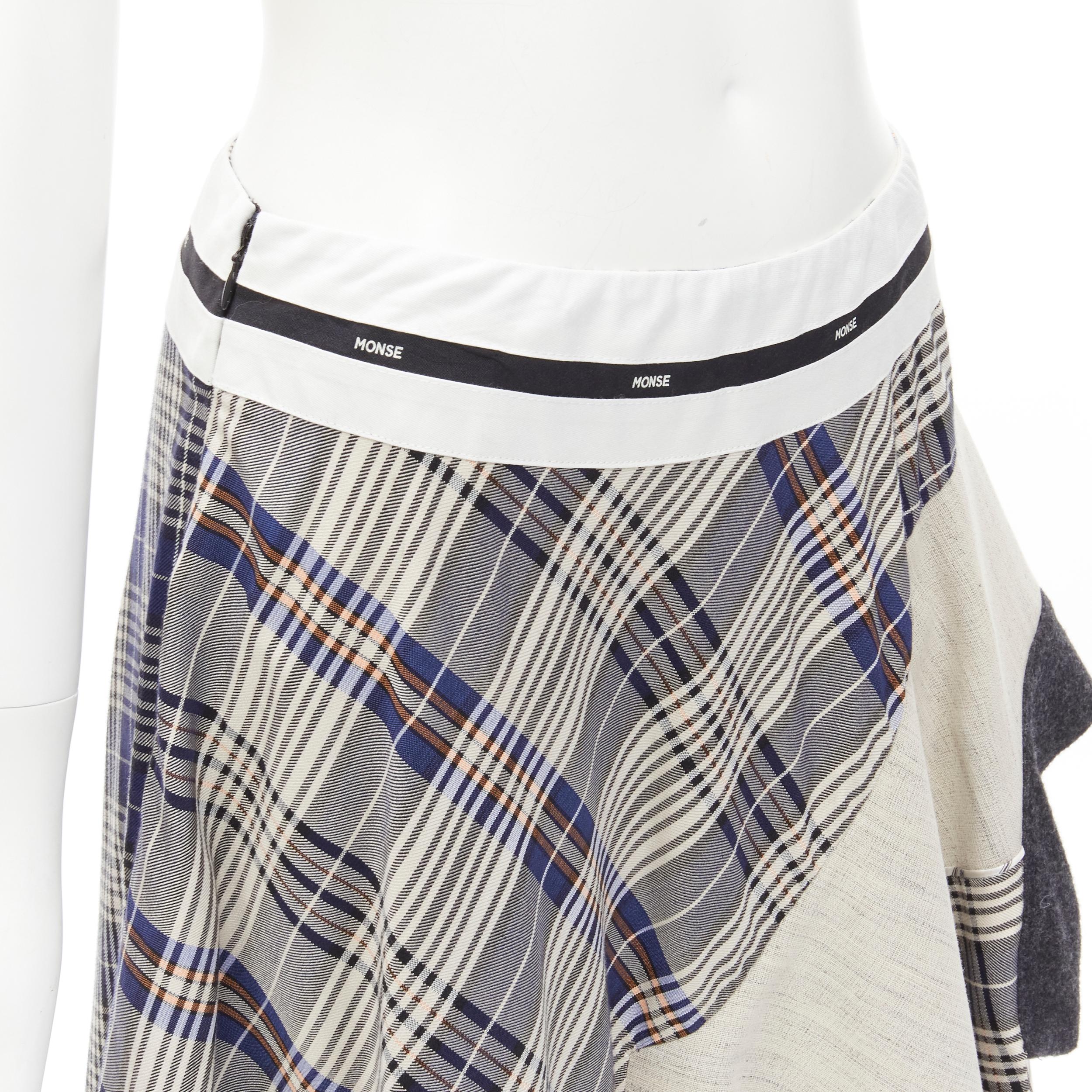 MONSE Runway mixed plaid patchwork asymmetric skirt US2 S
Brand: Monse
Material: Acetate
Color: Brown
Pattern: Plaid
Closure: Zip
Extra Detail: Logo trim at waistband. Asymmetric hemline with contrast 'lining' fabric layered.
Made in: United