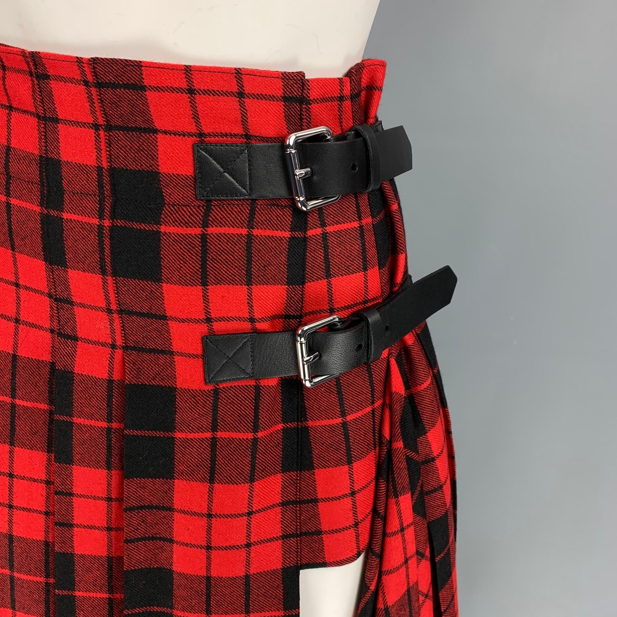 MONSE skirt comes ina  red & black plaid wool with a slip liner featuring a pleated style, front slit, side zipper,and a double leather buckle closure. 

New With Tags. 
Marked: 0
Original Retail Price: $1,395.00

Measurements:

Waist: 28 in.
Hip: