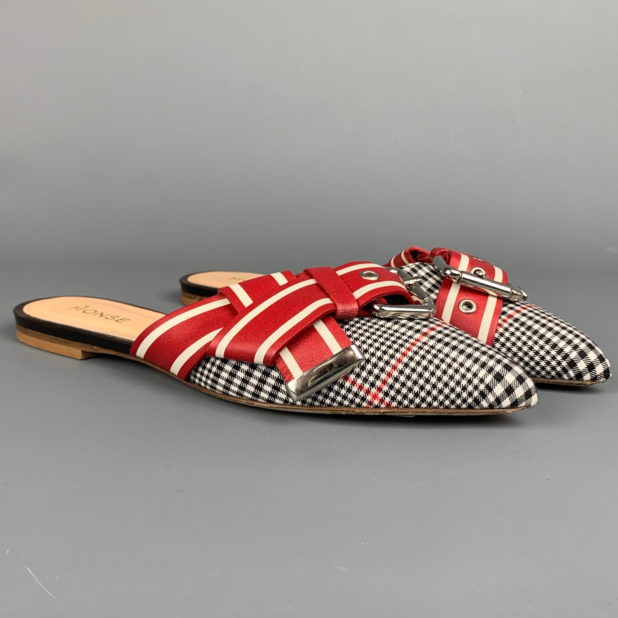 MONSE flats comes in a red & black print material featuring a mule style, pointed toe, buckle detail, and a wooden sole.

Very Good Pre-Owned Condition.
Marked: 38
Original Retail Price: $790.00

Outsole: 

10 in. x 3 in. 